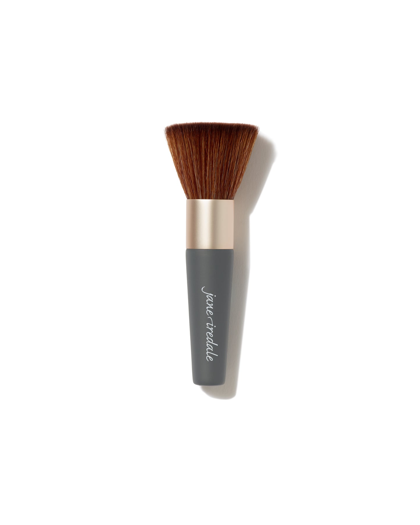 The Handi™ Brush by jane iredale, a kabuki-style brush with soft, dense bristles and a matte gold ferrule, ideal for flawless mineral powder application.