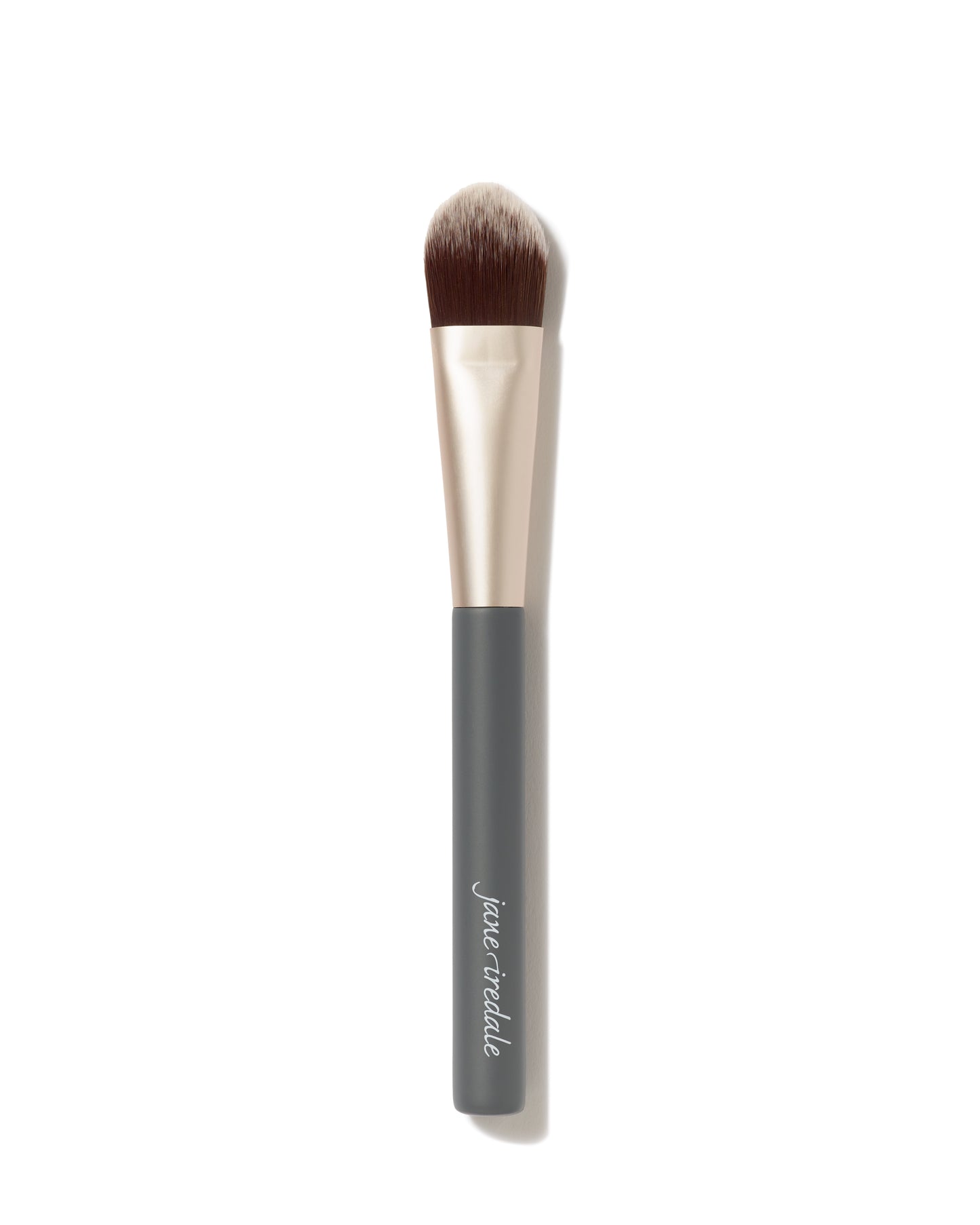 Liquid Complexion Brush: An angled, flat-top foundation brush with soft, dual-toned bristles and a dark gray handle, ideal for streak-free application of liquid and cream foundations.