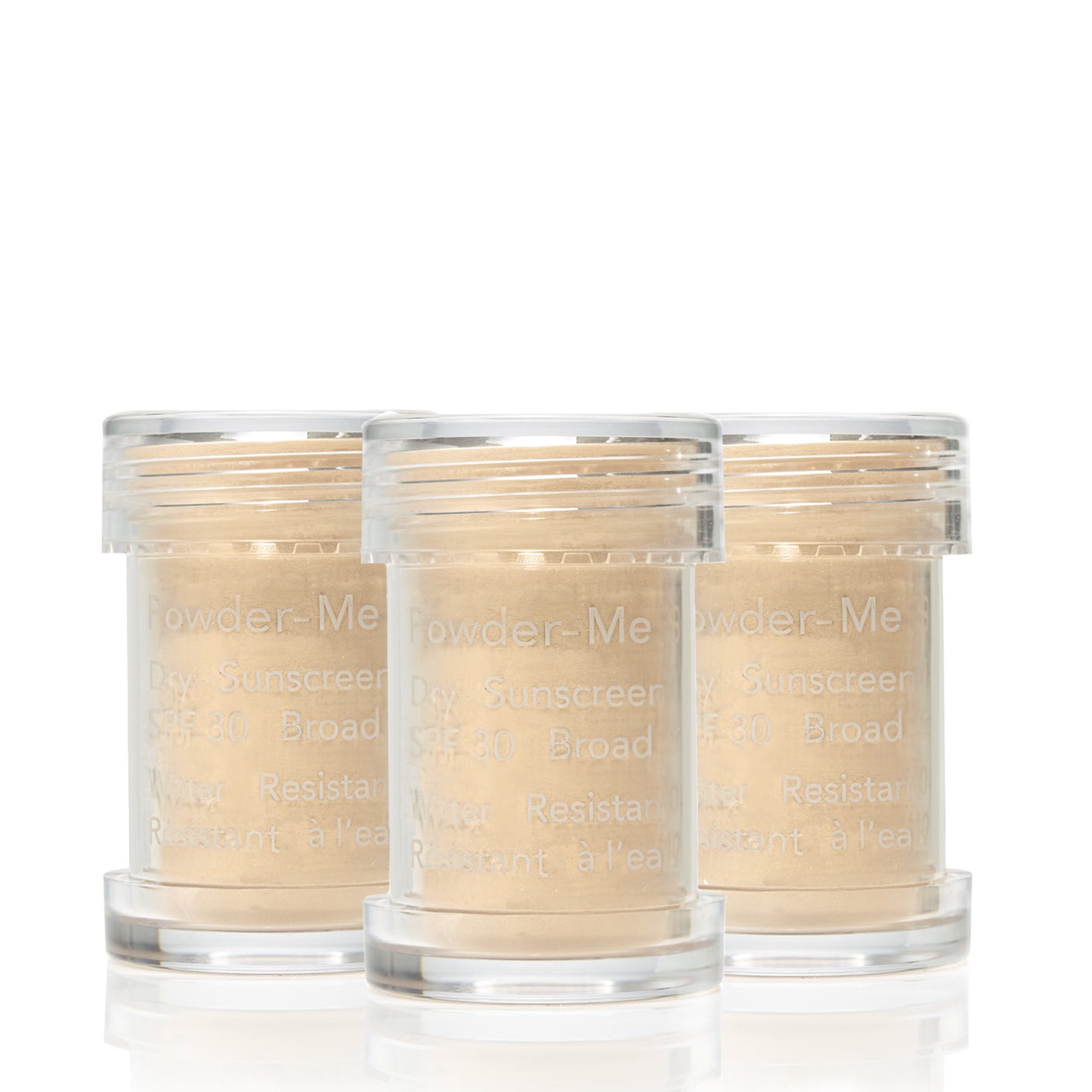 Powder-Me SPF 30 Dry Sunscreen: Three clear canisters of broad-spectrum, water-resistant dry sunscreen powder, ideal for beauty enthusiasts seeking clean, sustainable skincare solutions.