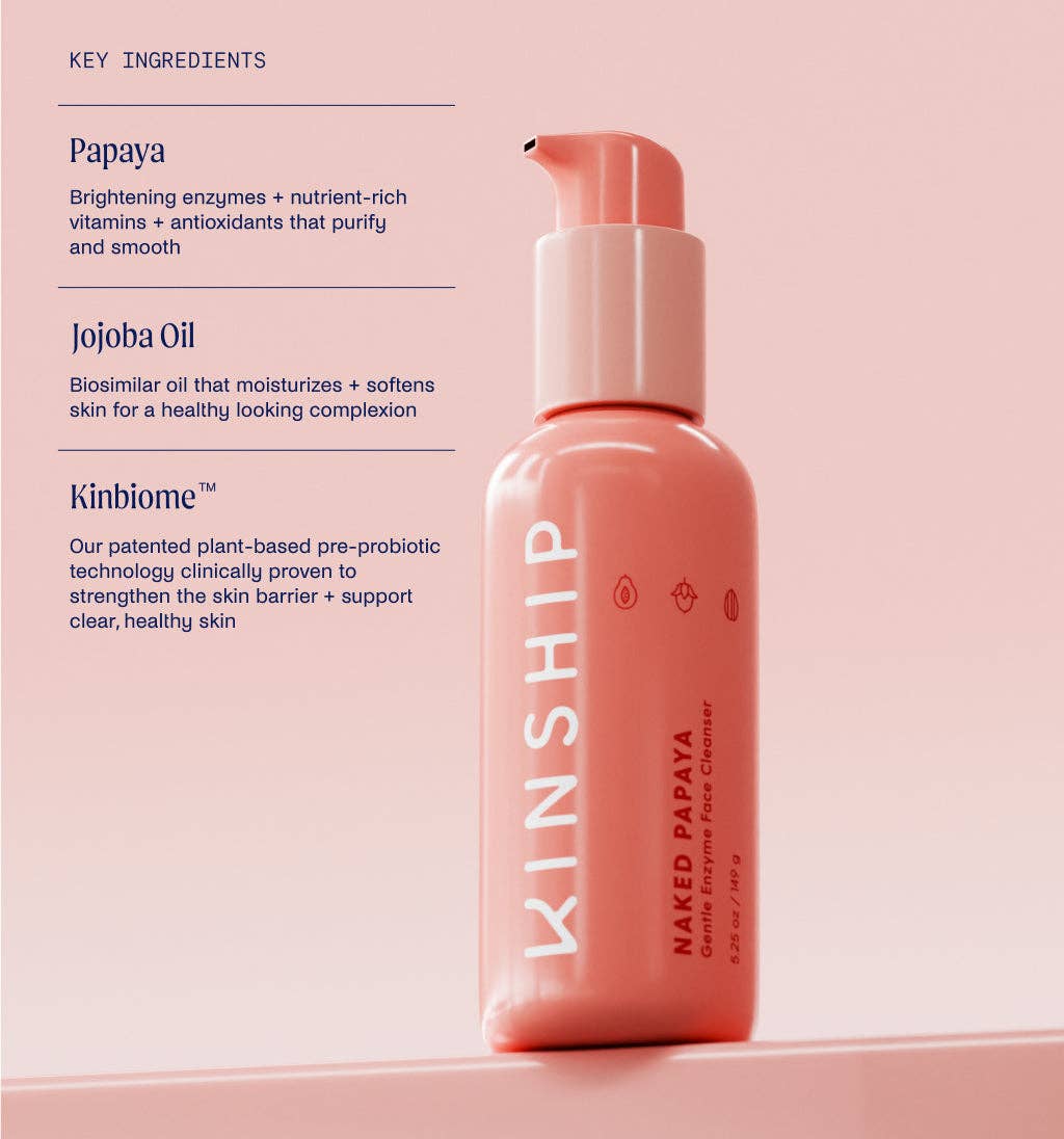KINSHIP Naked Papaya Gentle Enzyme Milky Cleanser in a pump bottle, highlighting key ingredients: papaya, jojoba oil, and Kinbiome™ for brightening and moisturizing sensitive skin.