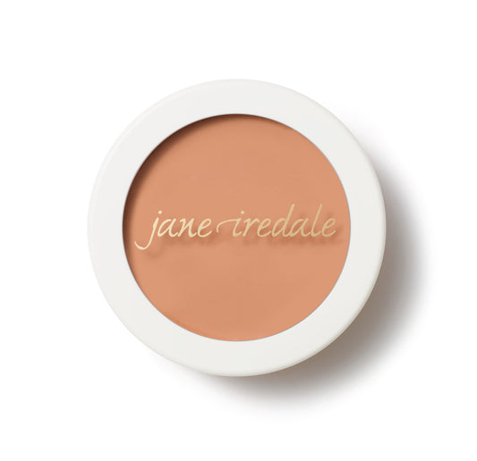 Jane Iredale Enlighten Concealer™ in a white compact, offering targeted brightening and blendable coverage for sensitive skin around eyes and nose.