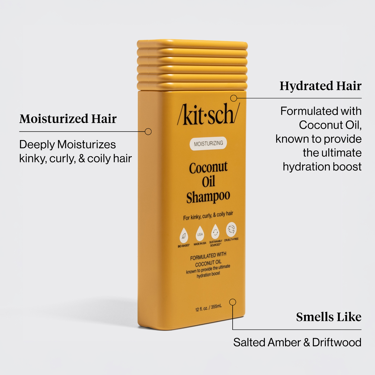 Moisturizing Coconut Oil Shampoo bottle highlighting features for kinky, curly hair: bio-based, cruelty-free, coconut oil for hydration, scented with salted amber and driftwood.