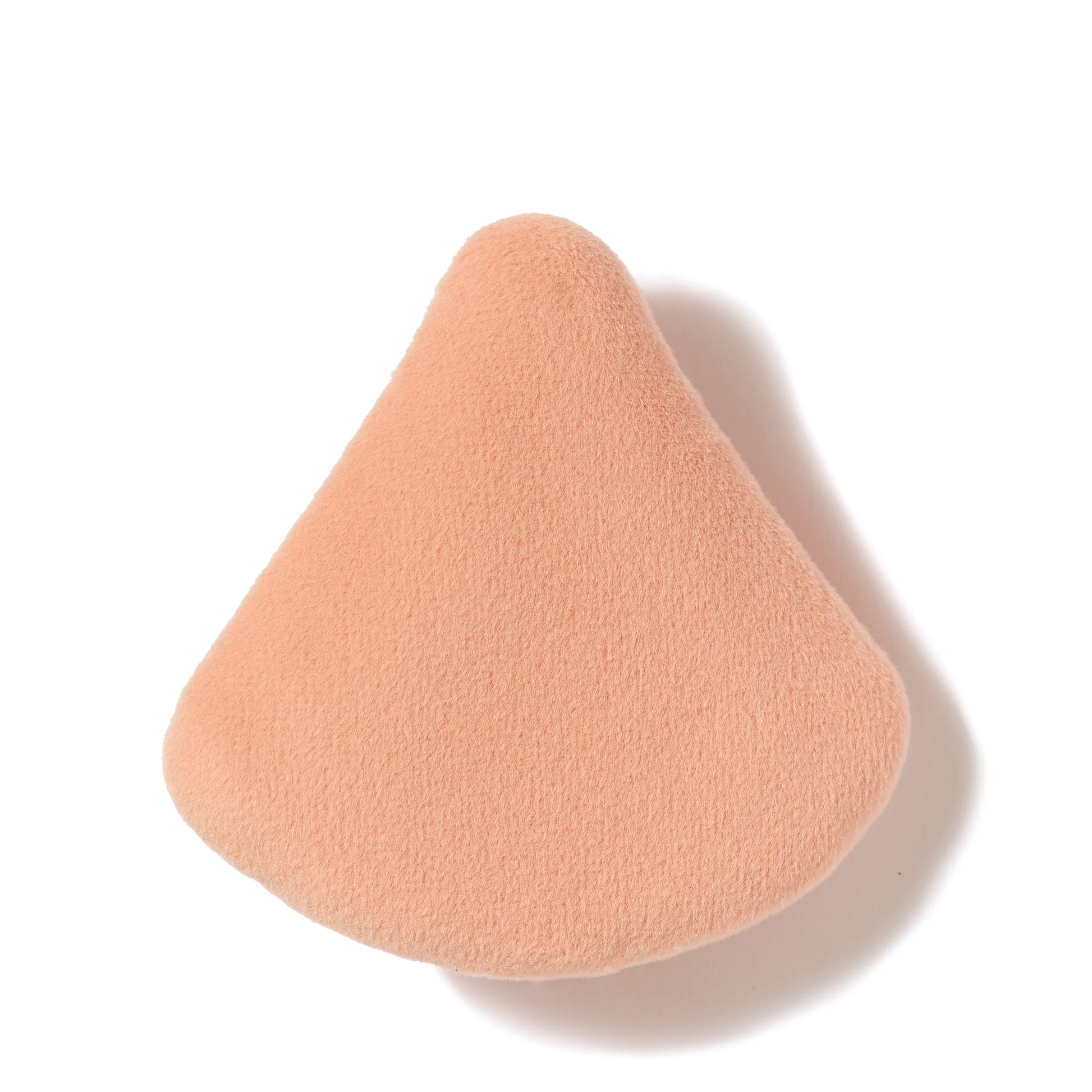 Perfect & Set™ Dual-Sided Puff, a triangular foam sponge, designed for flawless makeup application and shine control, ideal for on-the-go touch-ups.