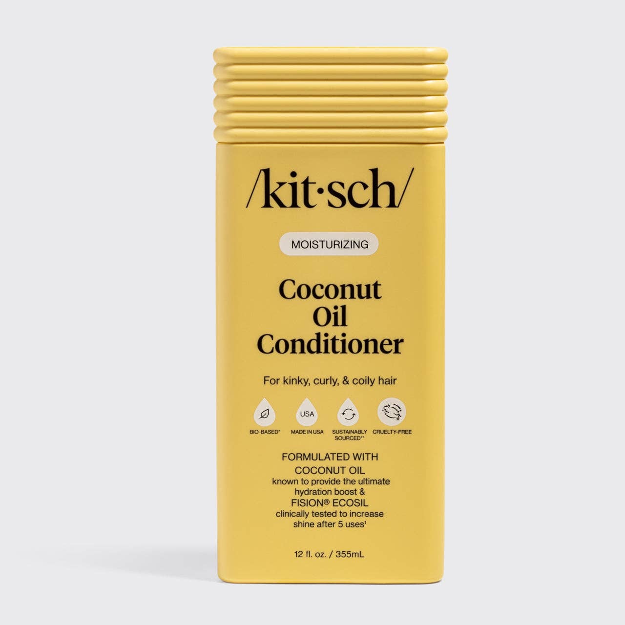 Yellow rectangular bottle of Kitsch Moisturizing Coconut Oil Conditioner, 12 fl. oz, bio-based, cruelty-free, formulated for kinky, curly, coily hair with coconut oil and FISION® Ecosil.