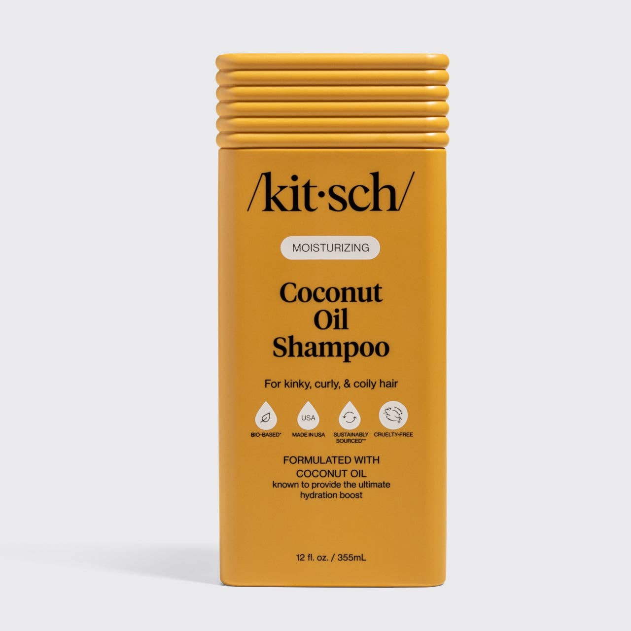 Moisturizing Coconut Oil Shampoo bottle for kinky, curly, coily hair, featuring hydration boost, bio-based, cruelty-free, and sustainably sourced icons.