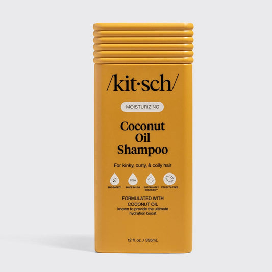 Moisturizing Coconut Oil Shampoo bottle for kinky, curly, coily hair, featuring hydration boost, bio-based, cruelty-free, and sustainably sourced icons.