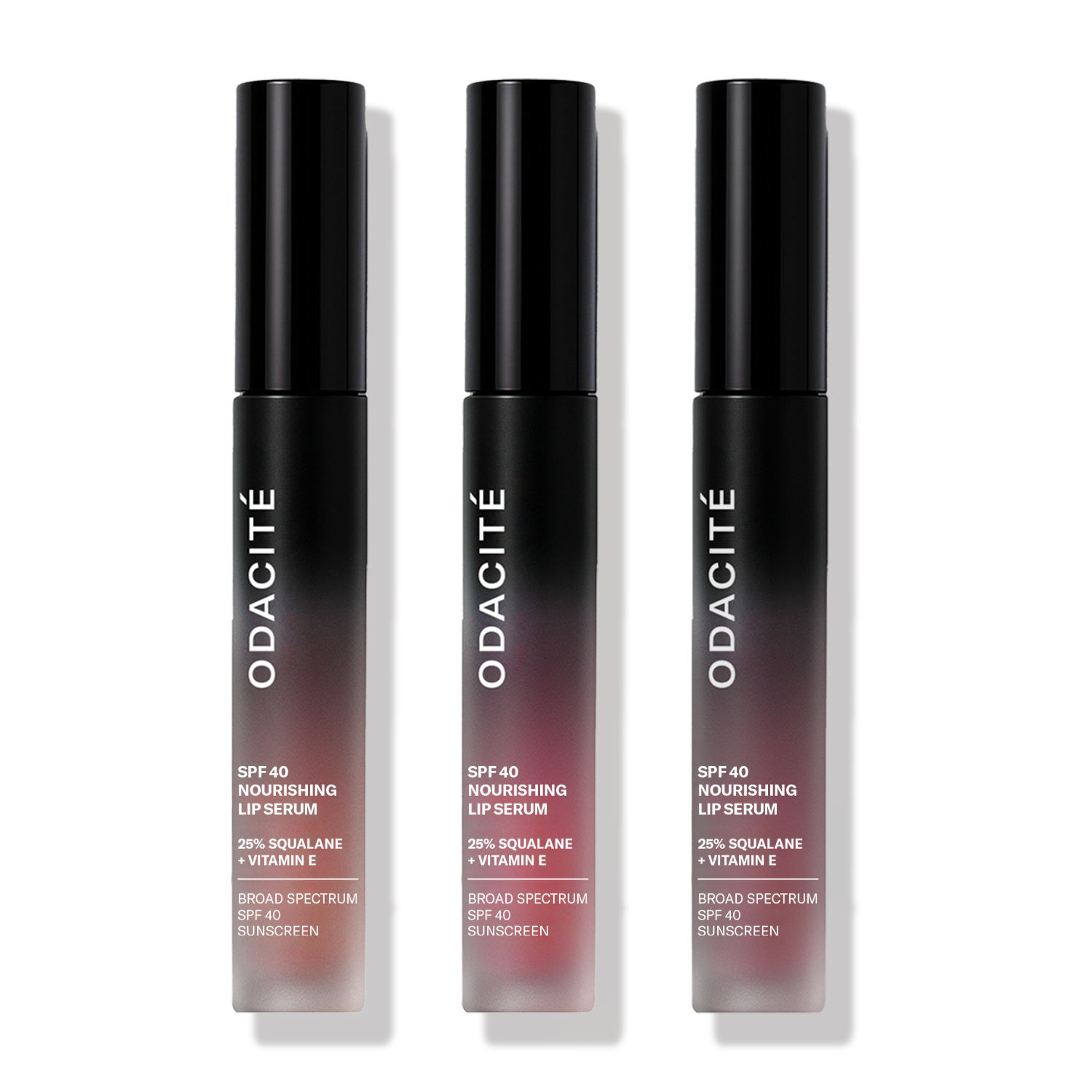 Three tubes of Odacité SPF 40 Nourishing Lip Serum with mineral Zinc Oxide, offering hydration, UV protection, and buildable color with a satin finish.