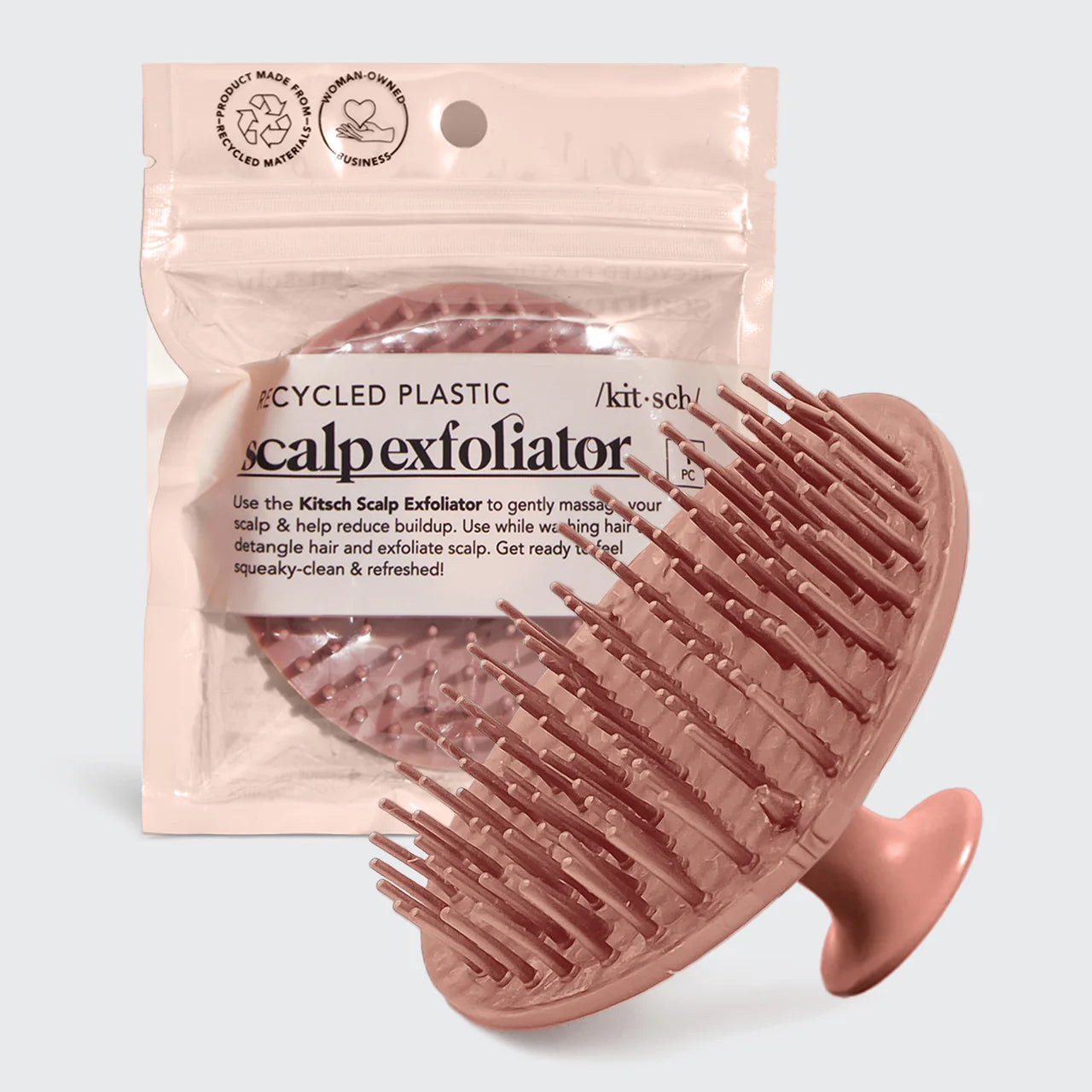 Scalp Exfoliator & Massaging Shampoo Brush with soft bristles and thumb-grip, shown with resealable pouch, ideal for scalp massage and hair detangling.