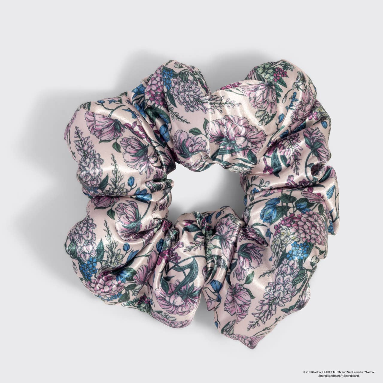 Bridgerton x Kitsch Satin Pillow Scrunchies® in Toile in Bloom features a silky, floral pattern, offering gentle, snag-free hold for all hair types.