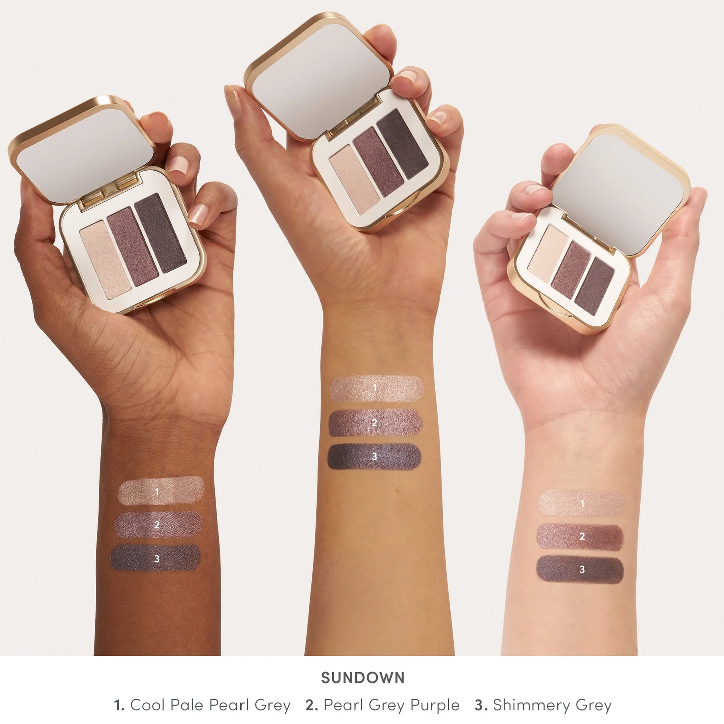 PurePressed® Eye Shadow Triple in Sundown with three shimmery grey-toned shades in a gold compact, displayed alongside swatches on diverse skin tones.
