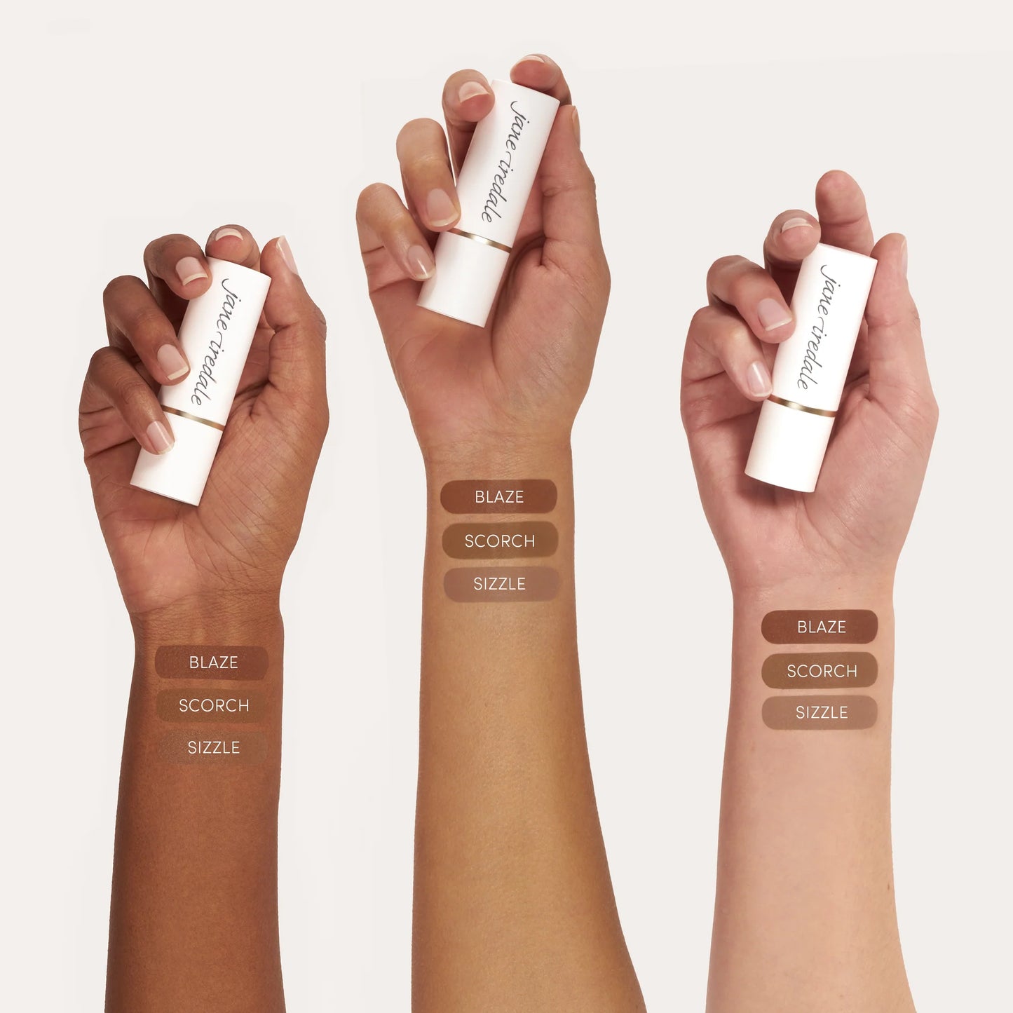Three forearms display the Glow Time® Bronzer Stick in shades BLAZE, SCORCH, SIZZLE, showcasing its buildable, natural finish across diverse skin tones.