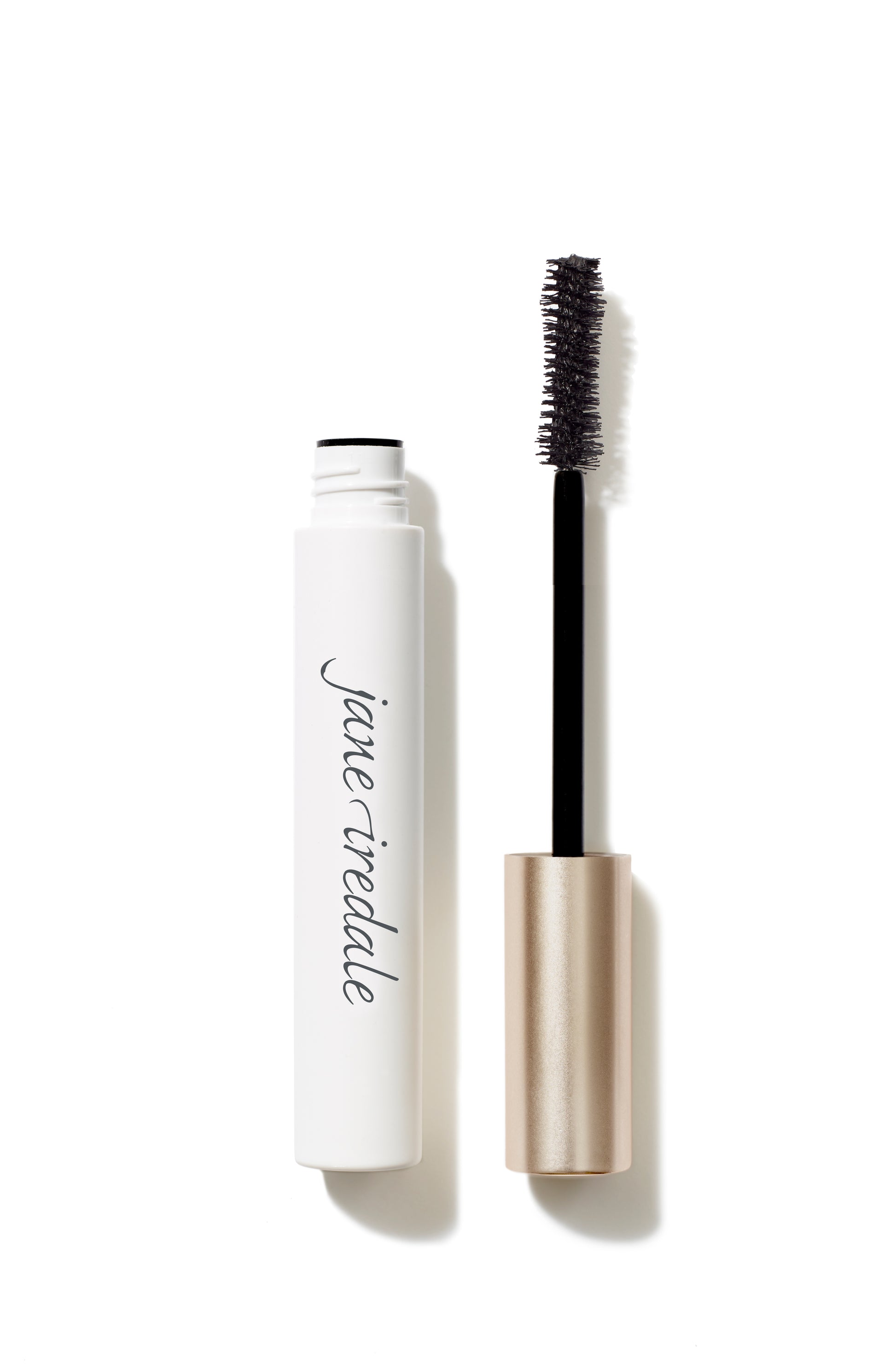 Beyond Lash™ Volumizing Mascara features a white tube and gold-tone wand, offering clean, buildable volume with a nourishing, naturally derived formula from Beauty Shop Bellaire.
