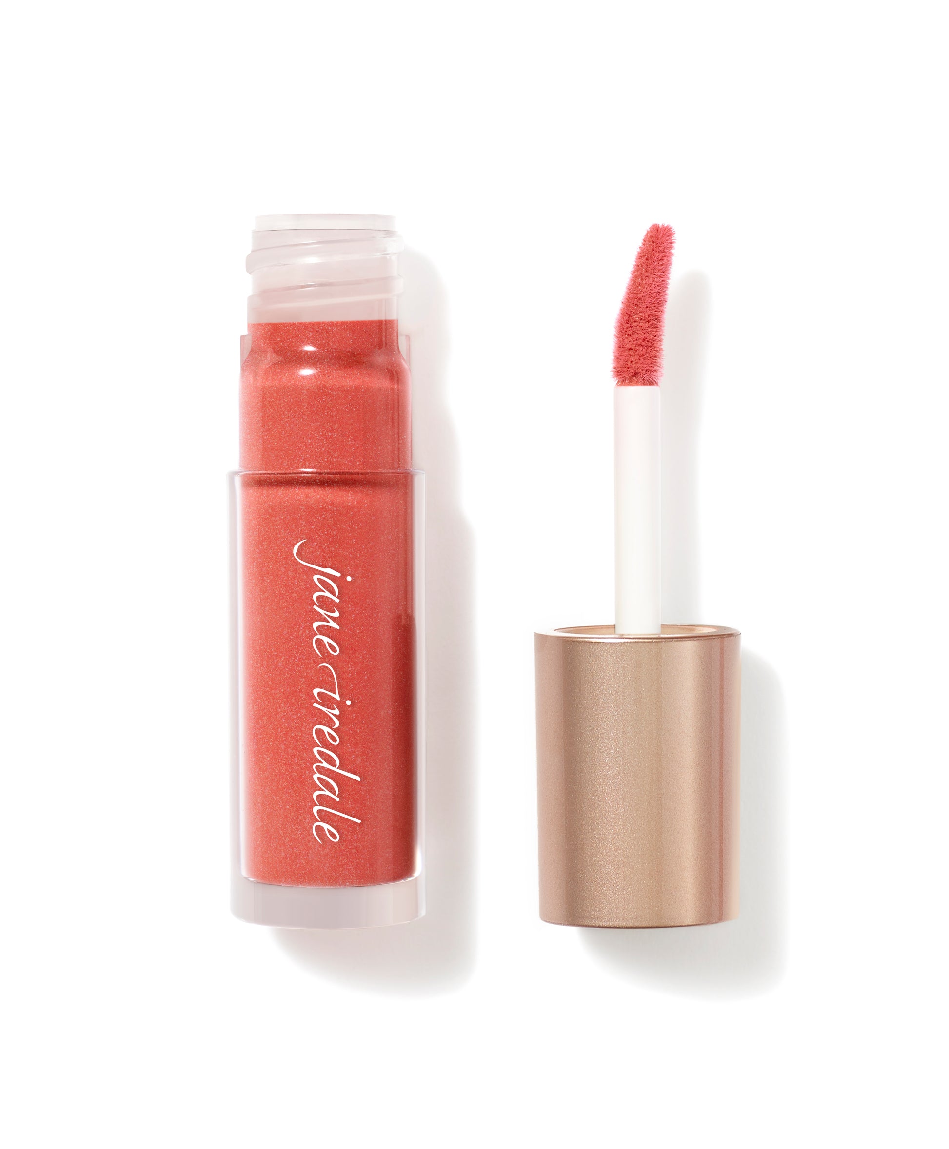 Beyond Matte® Lip Stain by jane iredale, coral-shimmer tube with doe-foot applicator, offers buildable, long-lasting matte color for comfortable, everyday wear.