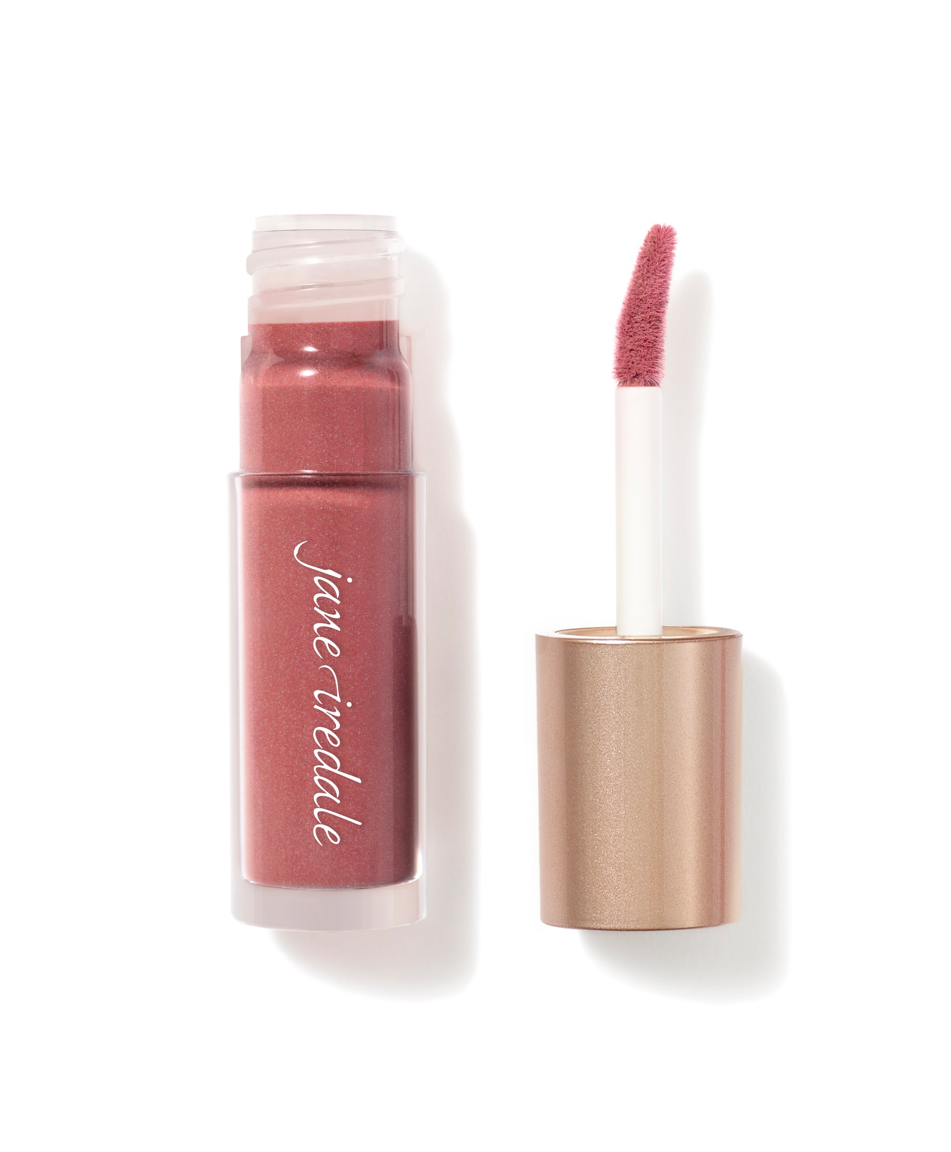 Beyond Matte® Lip Stain by jane iredale, a rose-toned lip gloss with a metallic rose-gold cap, offers long-wearing, buildable matte color with a comfortable finish.