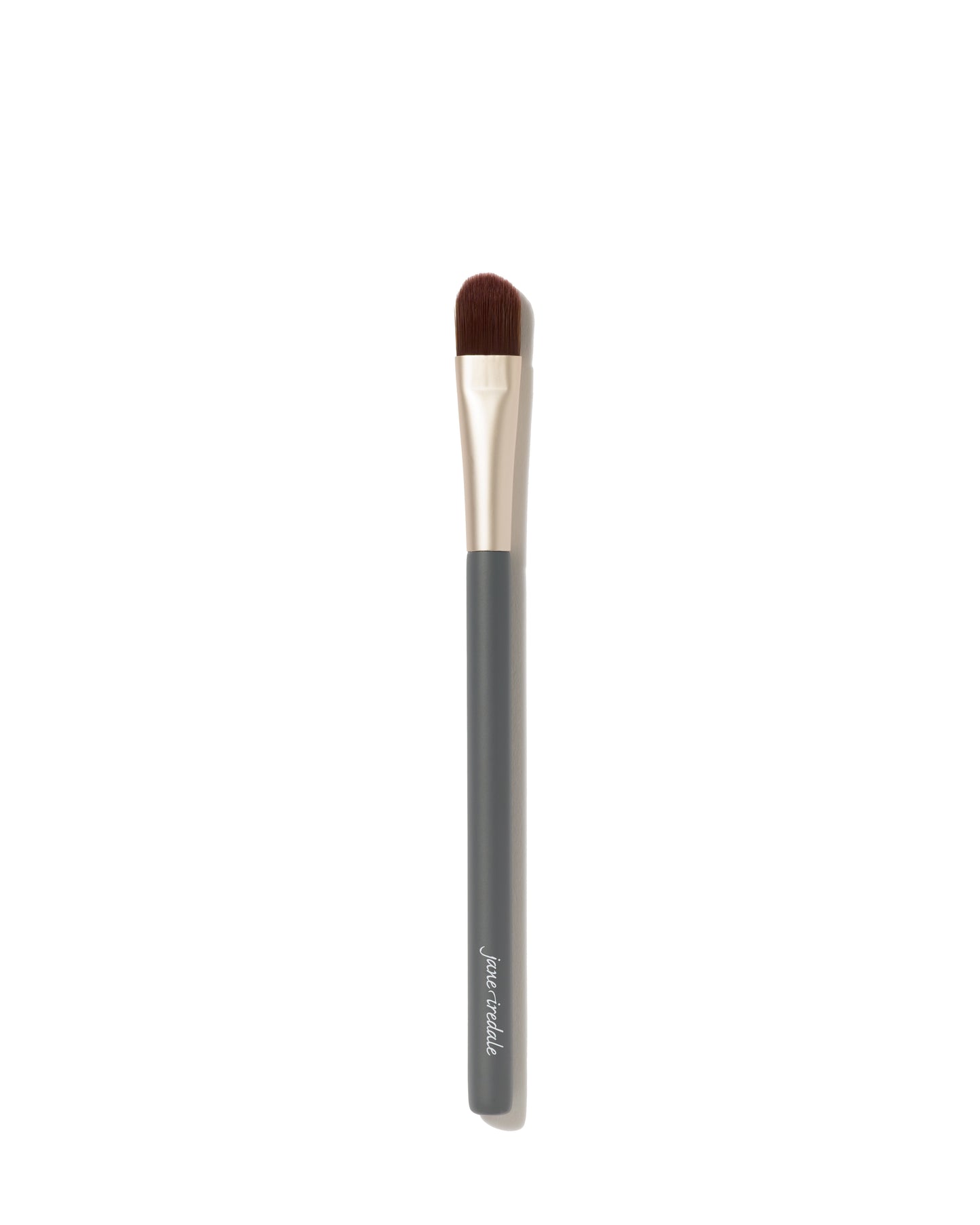 Camouflage Brush with dark handle, metallic ferrule, flat-topped bristles for flawless concealer application; crafted for even, professional results.