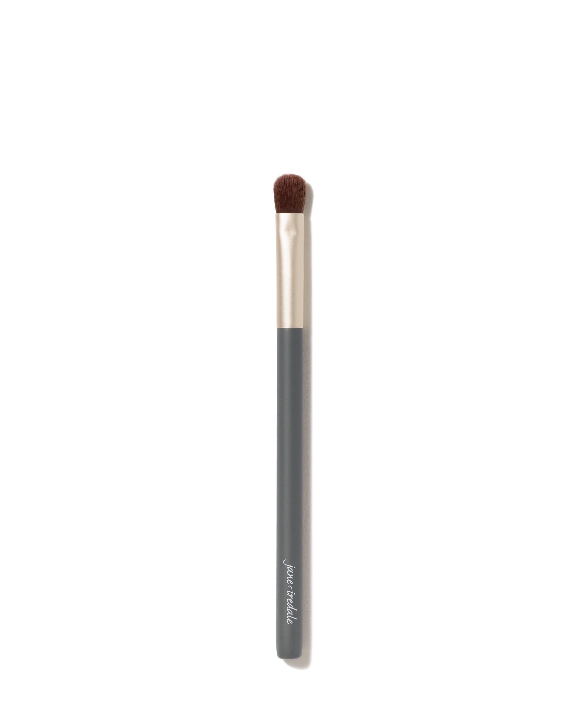 Flat Eye Brush with a dark gray handle and metallic ferrule, featuring a rounded bristle head for precise eyeshadow application.