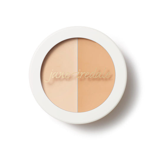 Jane Iredale Circle\Delete® Concealer compact with dual beige shades for spot correction and brightening. Features gold script branding, ideal for natural-looking coverage.