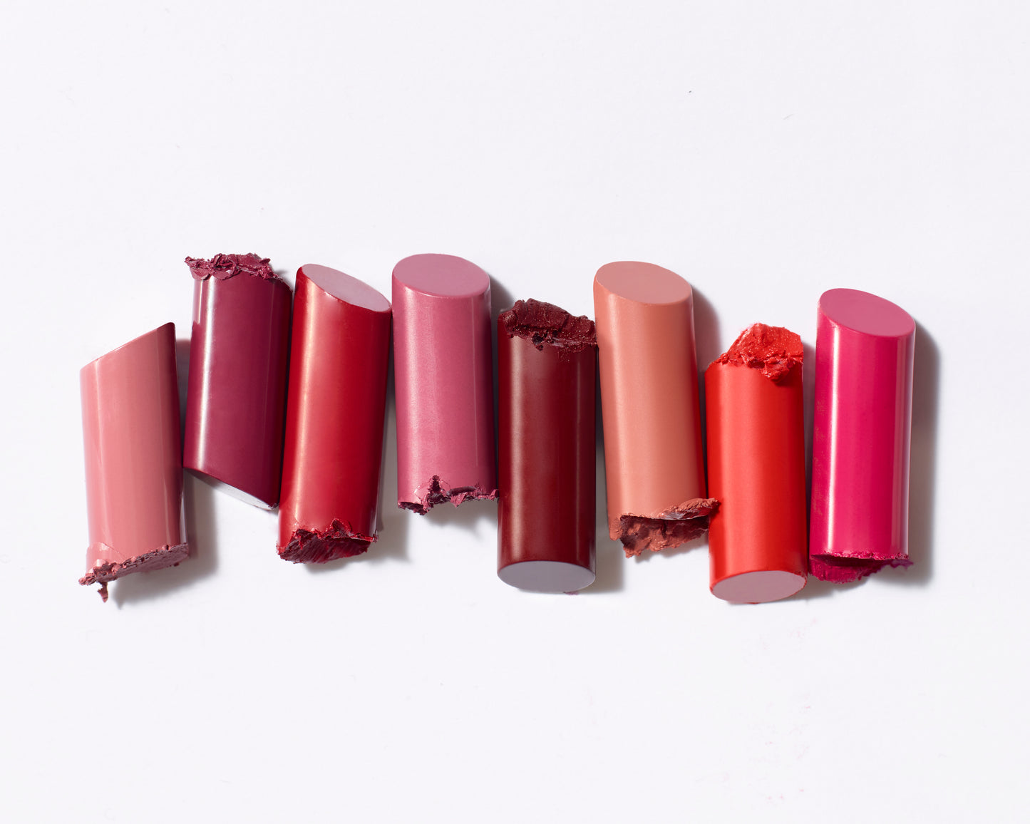 ColorLuxe Hydrating Cream Lipstick segments in varied shades, showcasing a creamy, nourishing formula with a satin finish, ideal for vibrant, all-day wear.