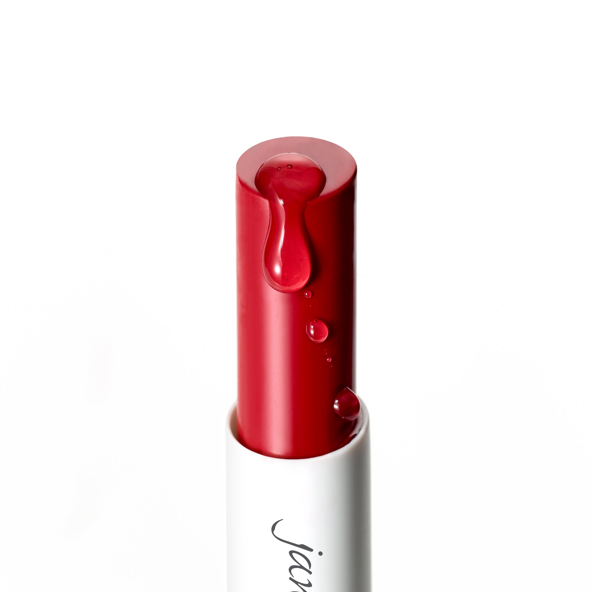 ColorLuxe Hydrating Cream Lipstick in white tube, with glossy red droplets, offers rich, vibrant color and comfortable, nourishing wear with a satin finish.