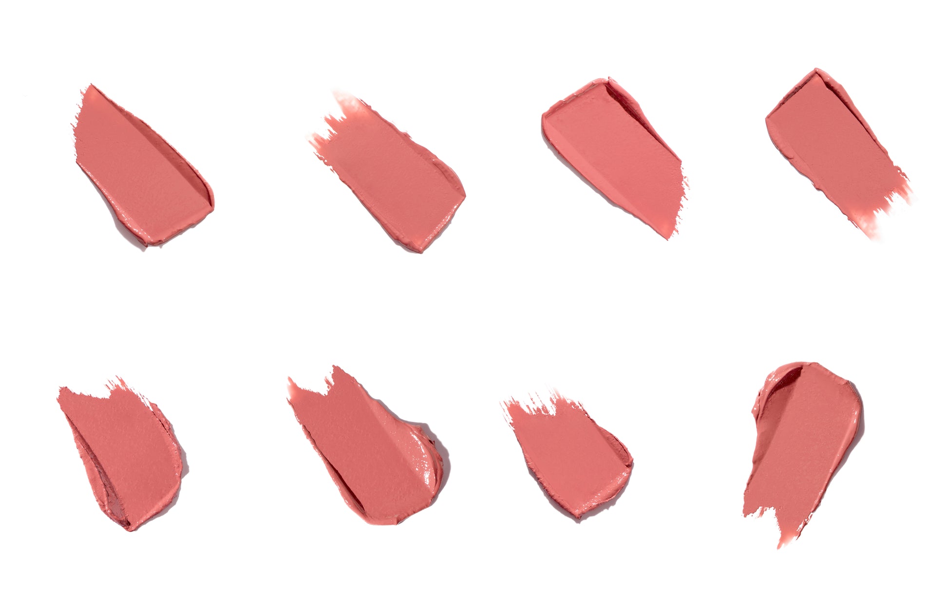 ColorLuxe Hydrating Cream Lipstick swatches showcase creamy texture and vibrant coral-pink shade, emphasizing its rich color and hydrating formula from Beauty Shop Bellaire.