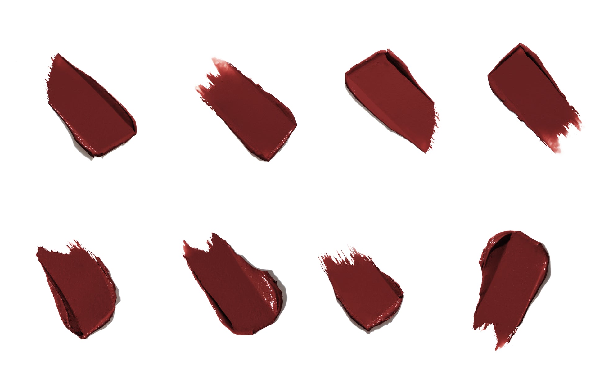 ColorLuxe Hydrating Cream Lipstick swatches in deep burgundy-red, showcasing the creamy, satin finish and rich color of this nourishing, long-lasting formula.