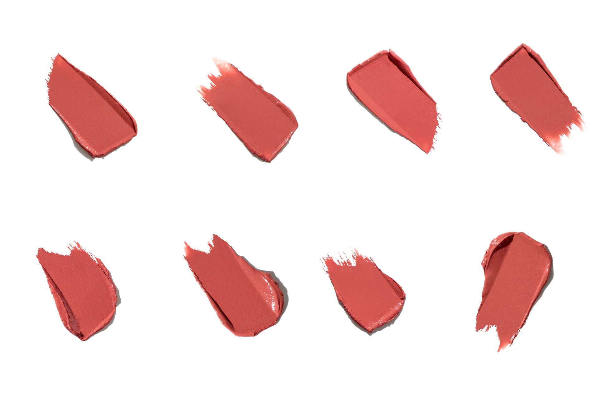 ColorLuxe Hydrating Cream Lipstick swatches in coral-rosy shades, showcasing its creamy texture and satin finish, highlighting its hydrating, comfortable wear from Beauty Shop Bellaire.