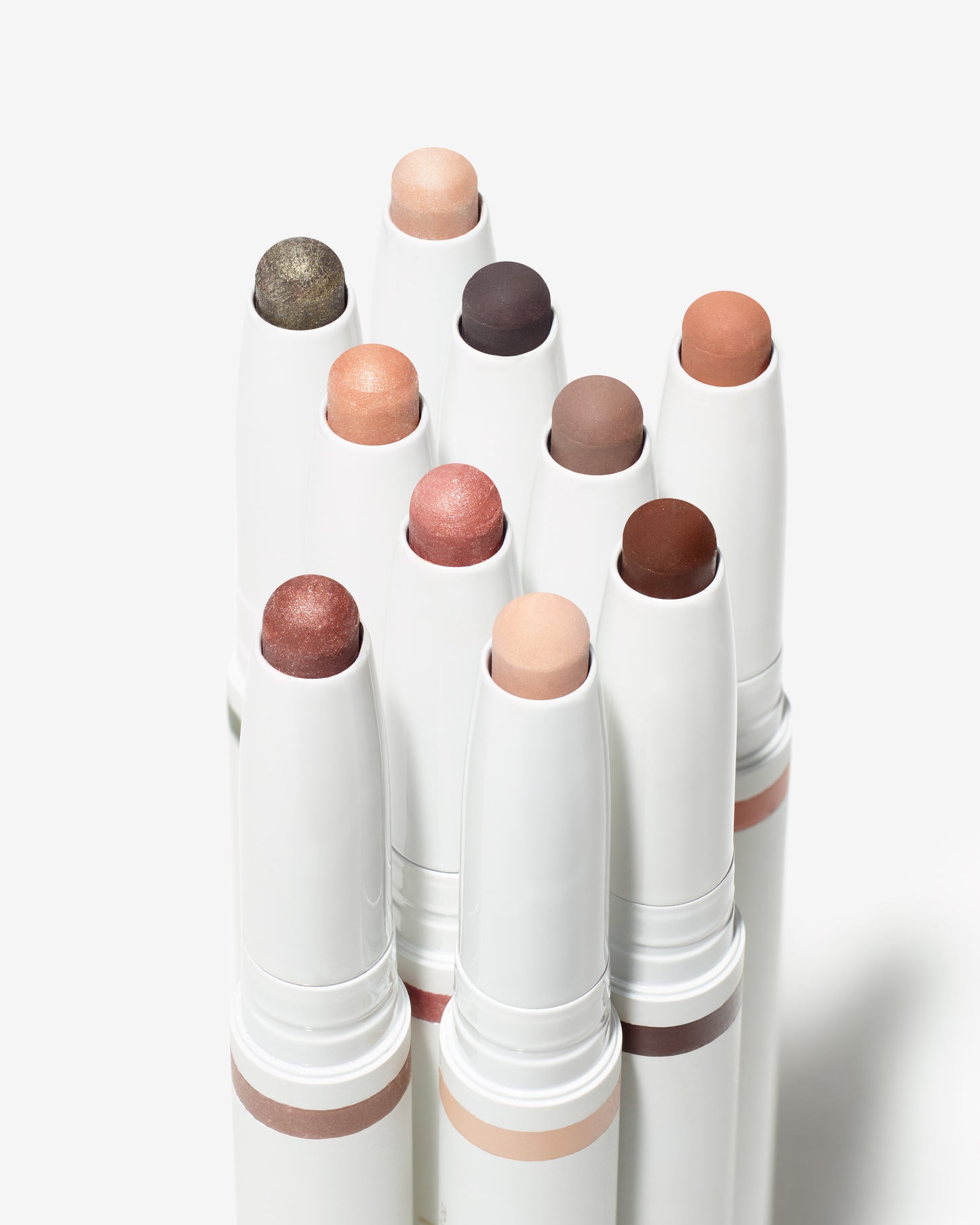ColorLuxe Eye Shadow Stick collection in various shades, featuring creamy, blendable tips for easy, no-brush application. Perfect for versatile eye looks.