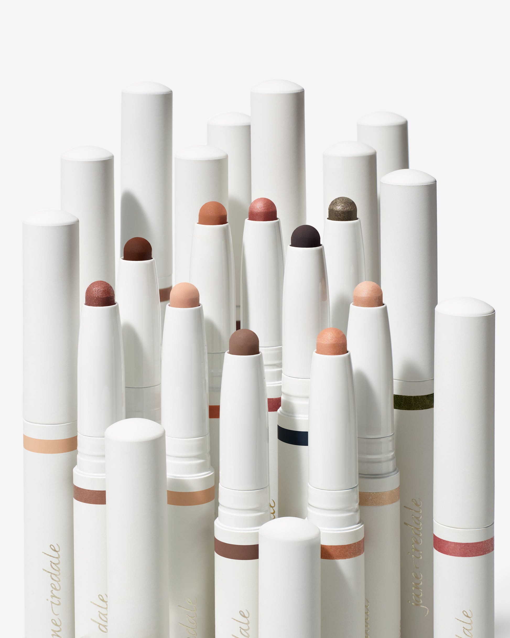 ColorLuxe Eye Shadow Stick display with twist-up tubes, revealing creamy tips in neutral and metallic shades. Ideal for blendable, brush-free application with long-lasting wear.
