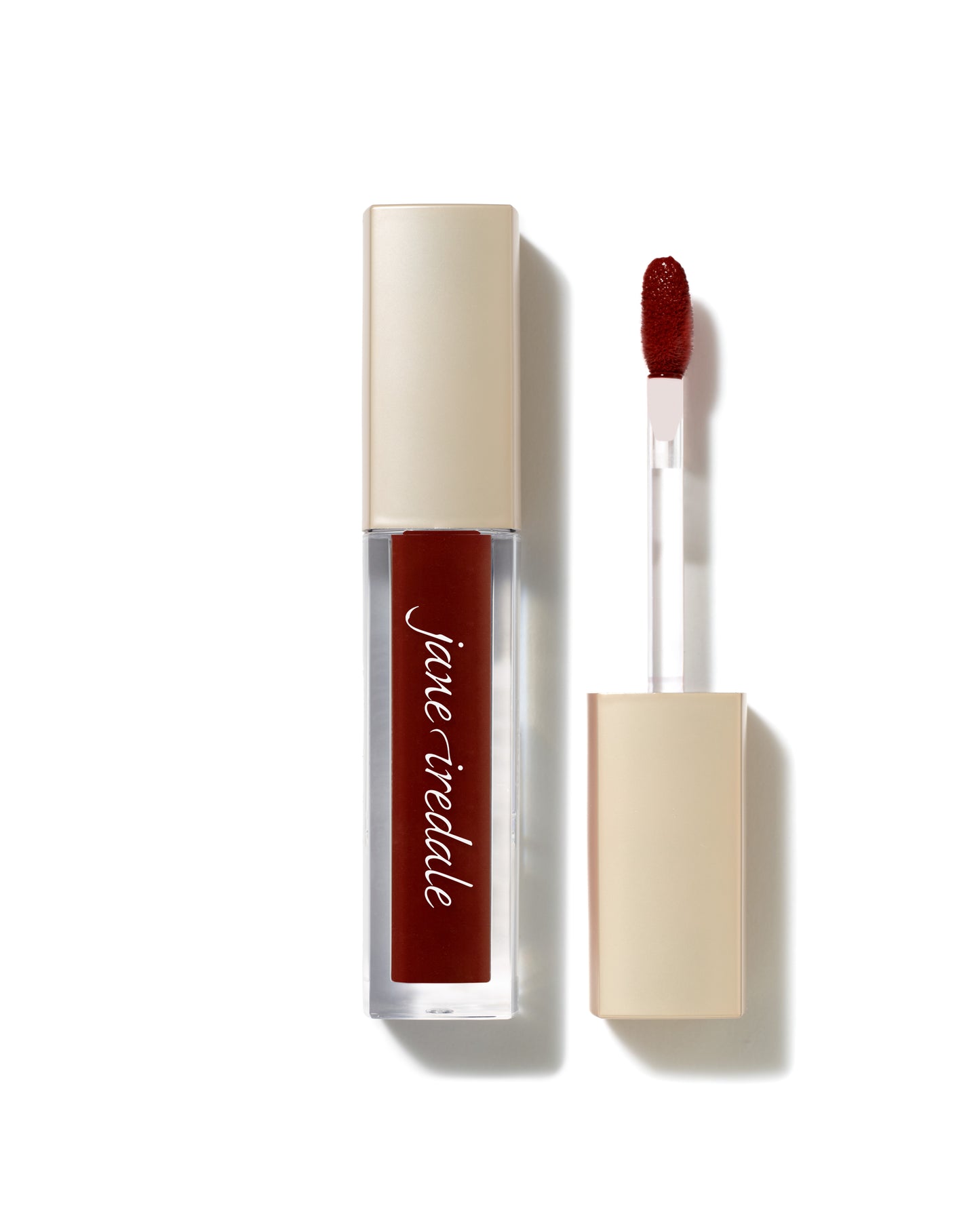 ColorLuxe High Impact Lip Glaze in a clear tube with matte beige cap and doe-foot applicator, offering bold, glossy color and nourishing comfort.