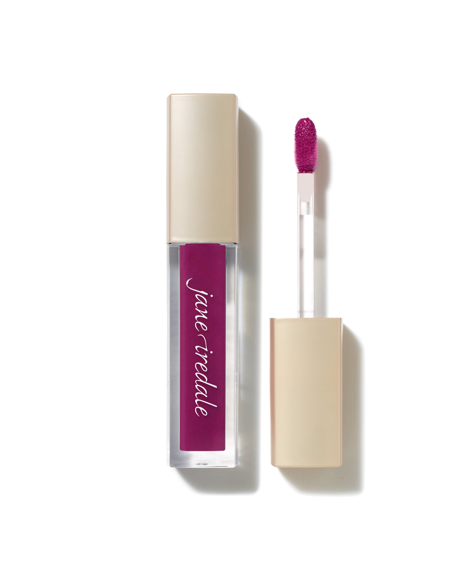 ColorLuxe High Impact Lip Glaze in clear tube with gold cap and doe-foot applicator, showcasing a deep fuchsia shade, offers a glossy, nourishing finish.