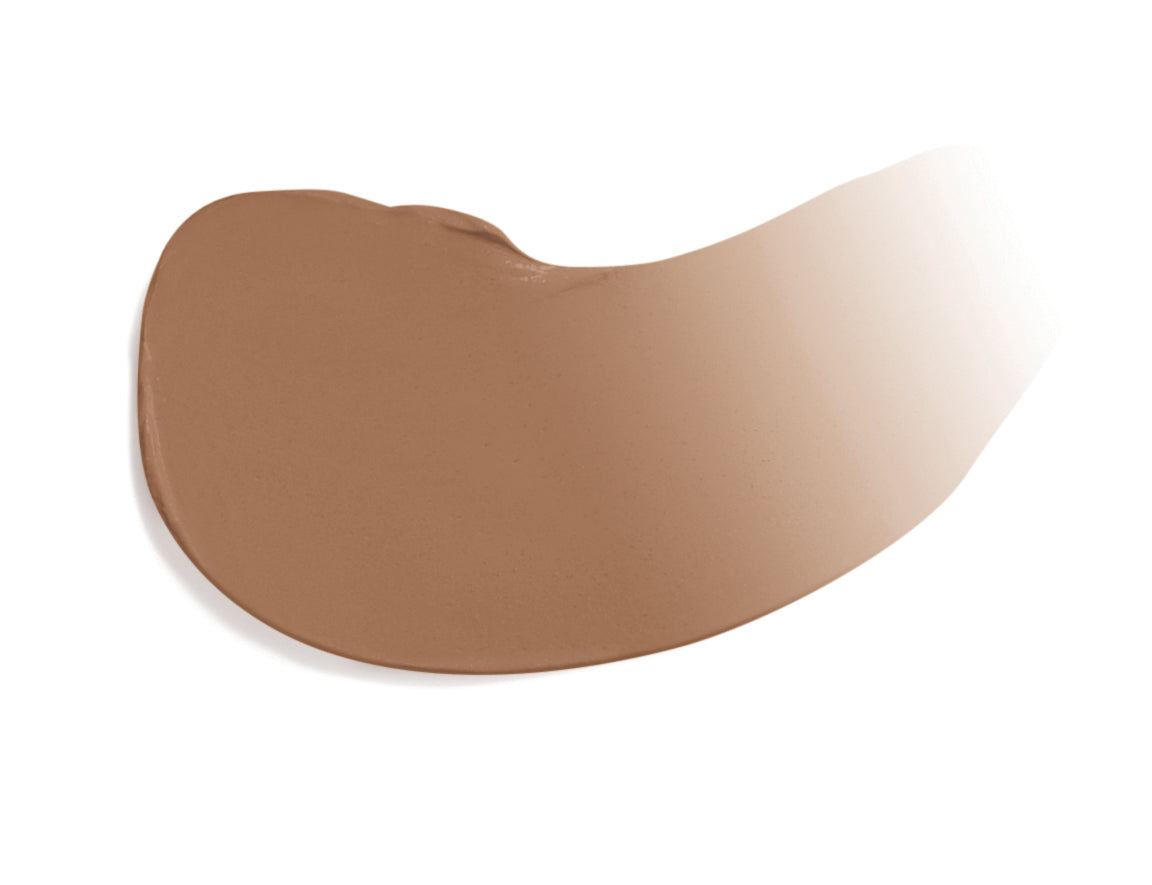 Dream Tint® Tinted Moisturizer SPF 15 swatch; medium-brown, cream-textured, showcasing its lightweight, hydrating formula and natural finish for a 'no-makeup' look.