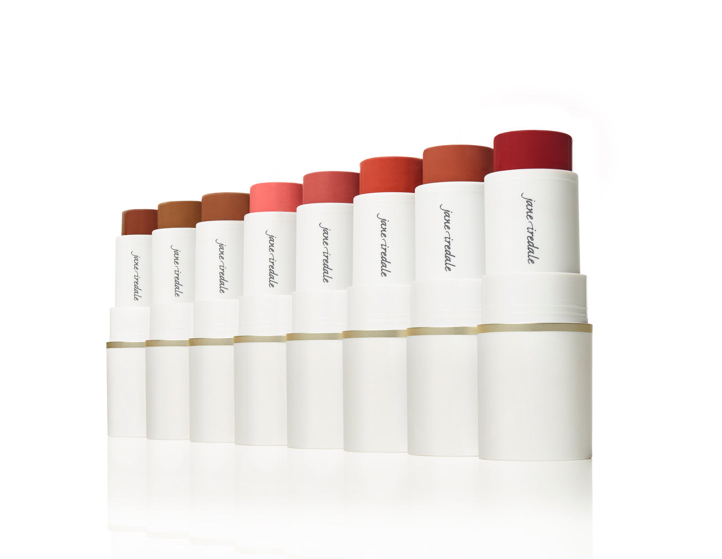 Nine Glow Time® Blush Sticks by jane iredale, showcasing creamy pigments for lips and cheeks with a natural, skin-like finish in varying shades of browns, corals, and reds.