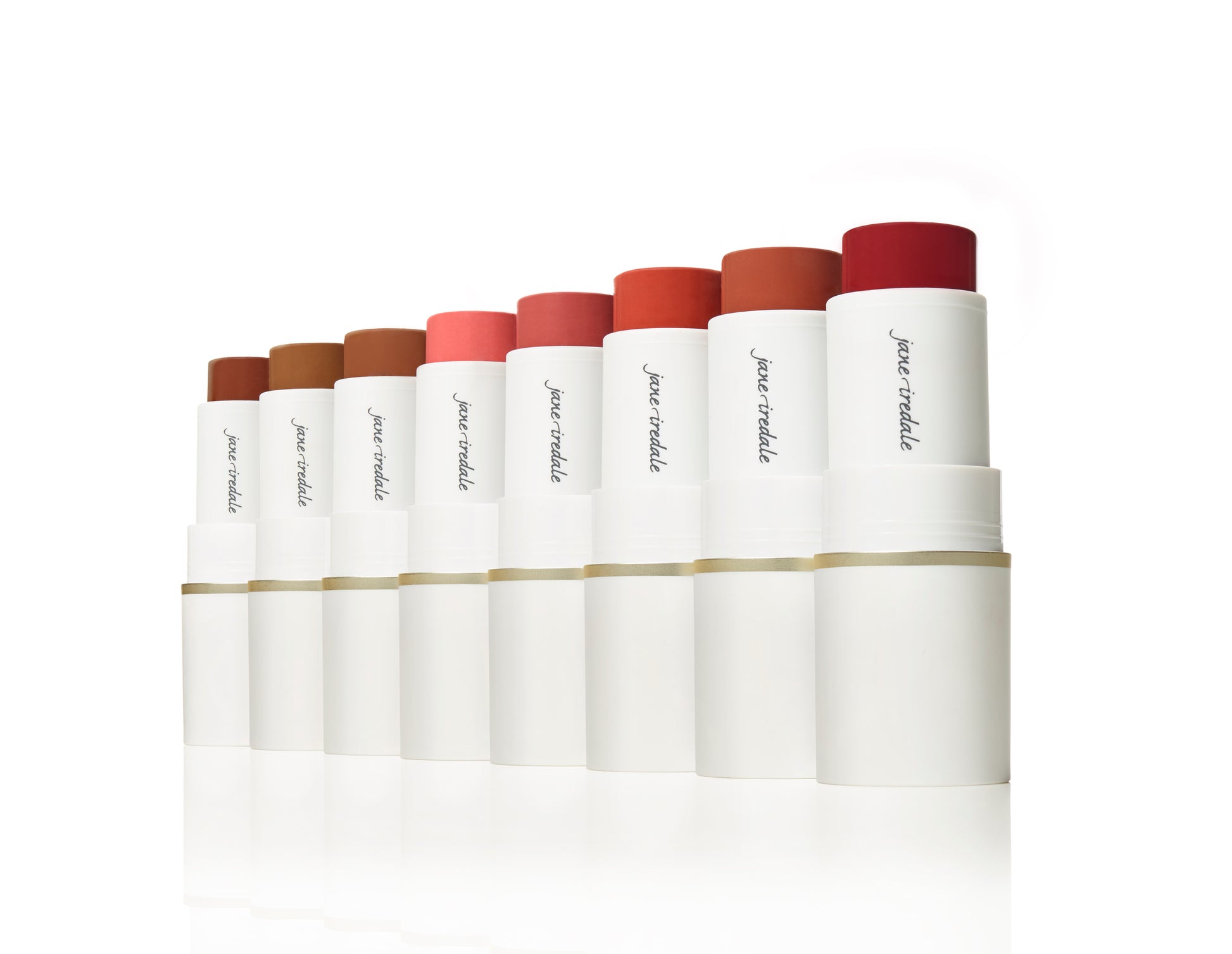 Nine Glow Time® Blush Sticks by jane iredale, showcasing creamy pigments for lips and cheeks with a natural, skin-like finish in varying shades of browns, corals, and reds.