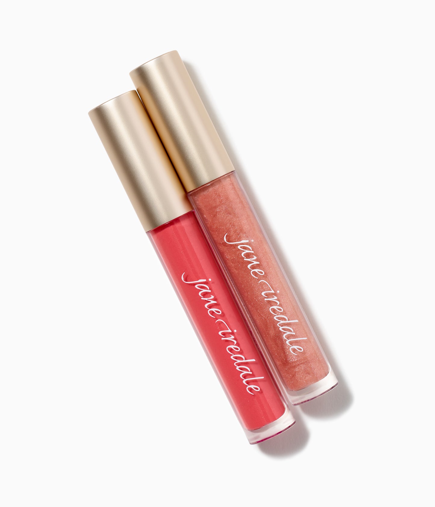 Jane Iredale HydroPure™ Hyaluronic Acid Lip Gloss tubes with gold caps, featuring berry-pink and peach-coral shades, offering hydration, plumping, and high shine.
