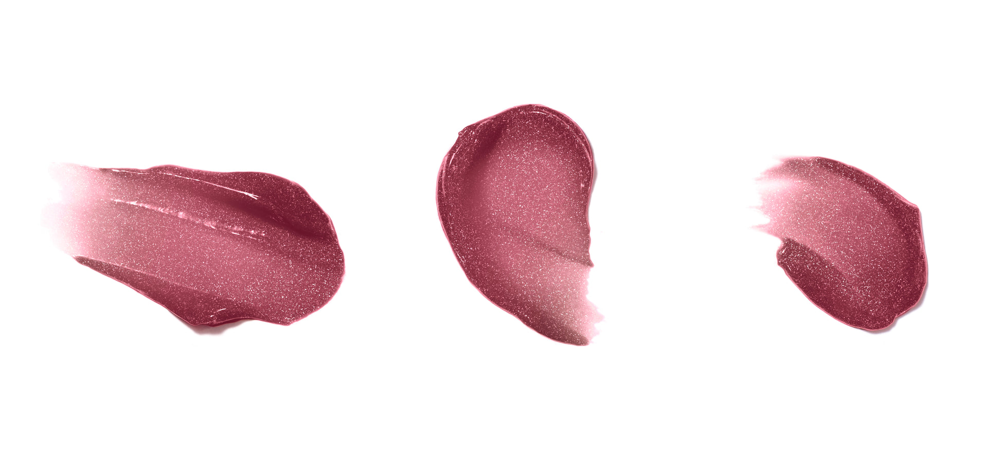 Swatches of HydroPure™ Hyaluronic Acid Lip Gloss show glossy, shimmery textures, highlighting its hydrating, plumping formula with a high-shine, non-sticky finish.