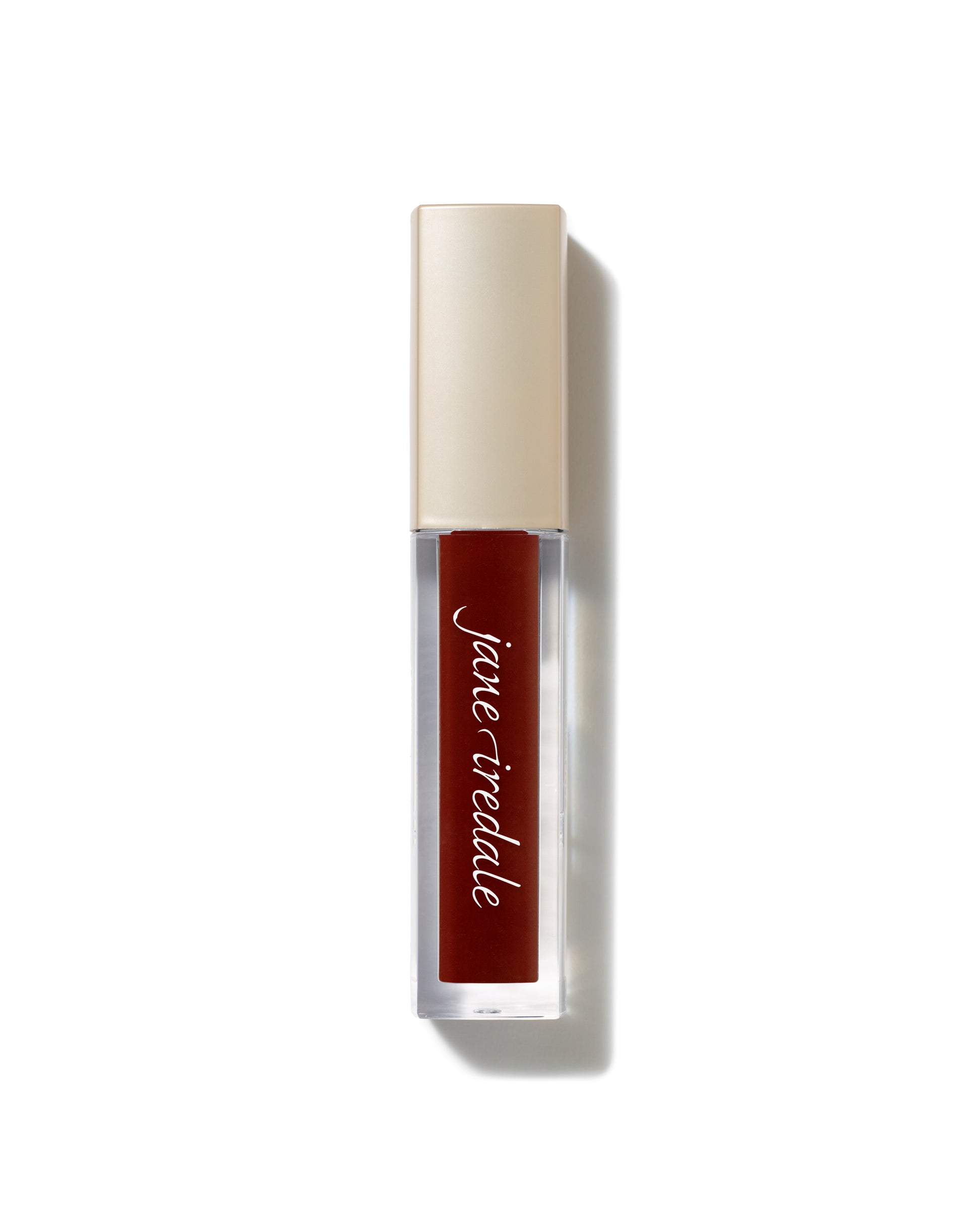 ColorLuxe High Impact Lip Glaze in a brick-red shade, featuring a glossy finish and gold cap, combines lipstick pigmentation with gloss shine for bold, nourishing wear.