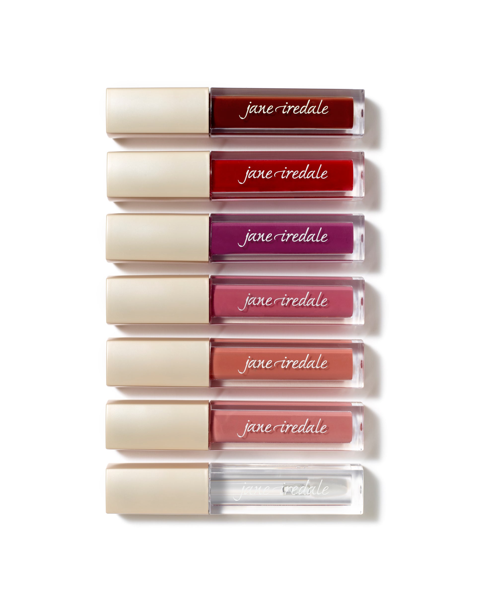 ColorLuxe High Impact Lip Glaze tubes showcasing vibrant shades with glossy finish, ideal for bold lips. Features nourishing, non-sticky formula for comfortable wear.