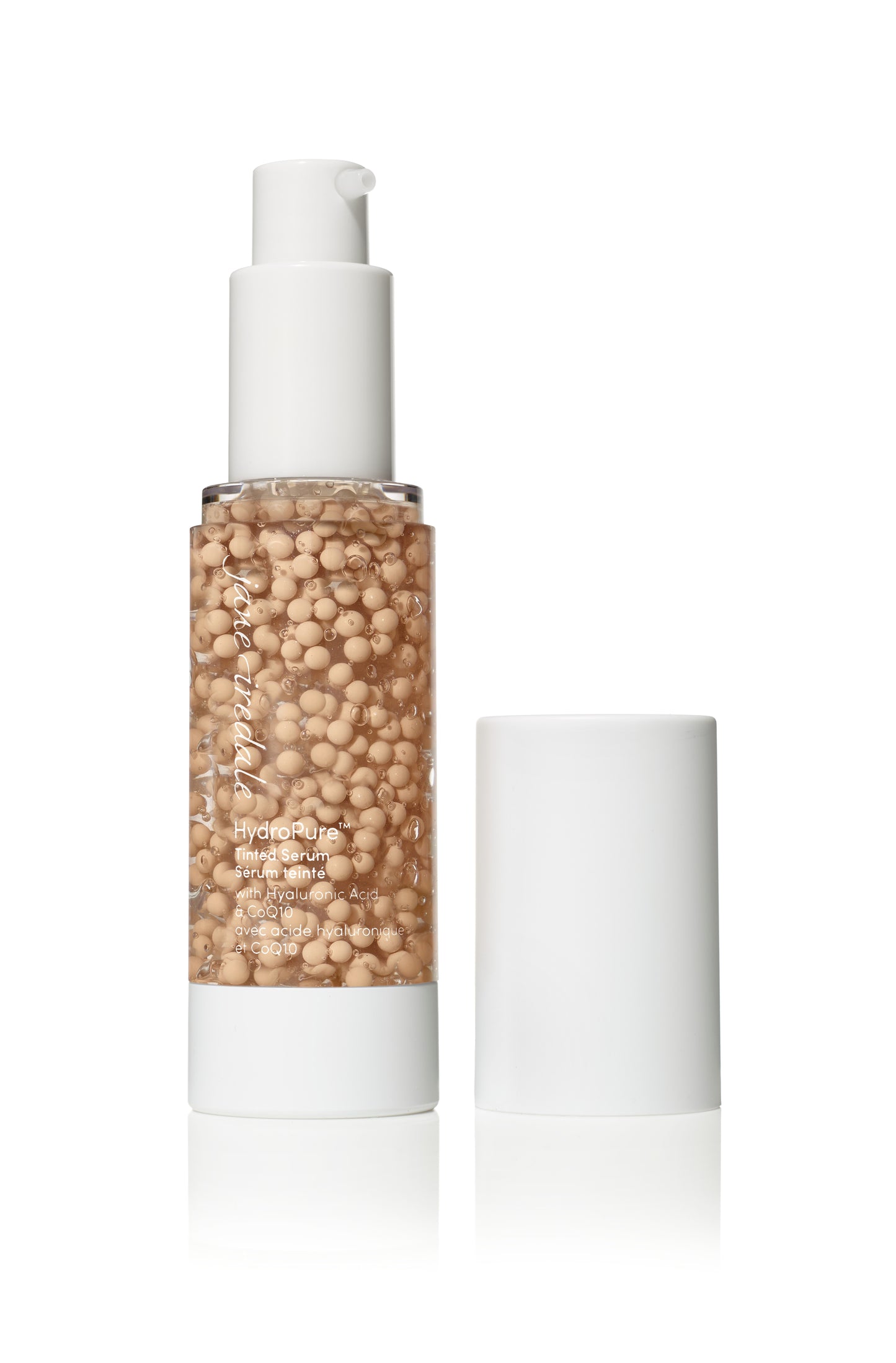Jane Iredale’s HydroPure™ Tinted Serum bottle with visible beige pigment beads, featuring Hyaluronic Acid and CoQ10, offering light coverage and deep hydration.