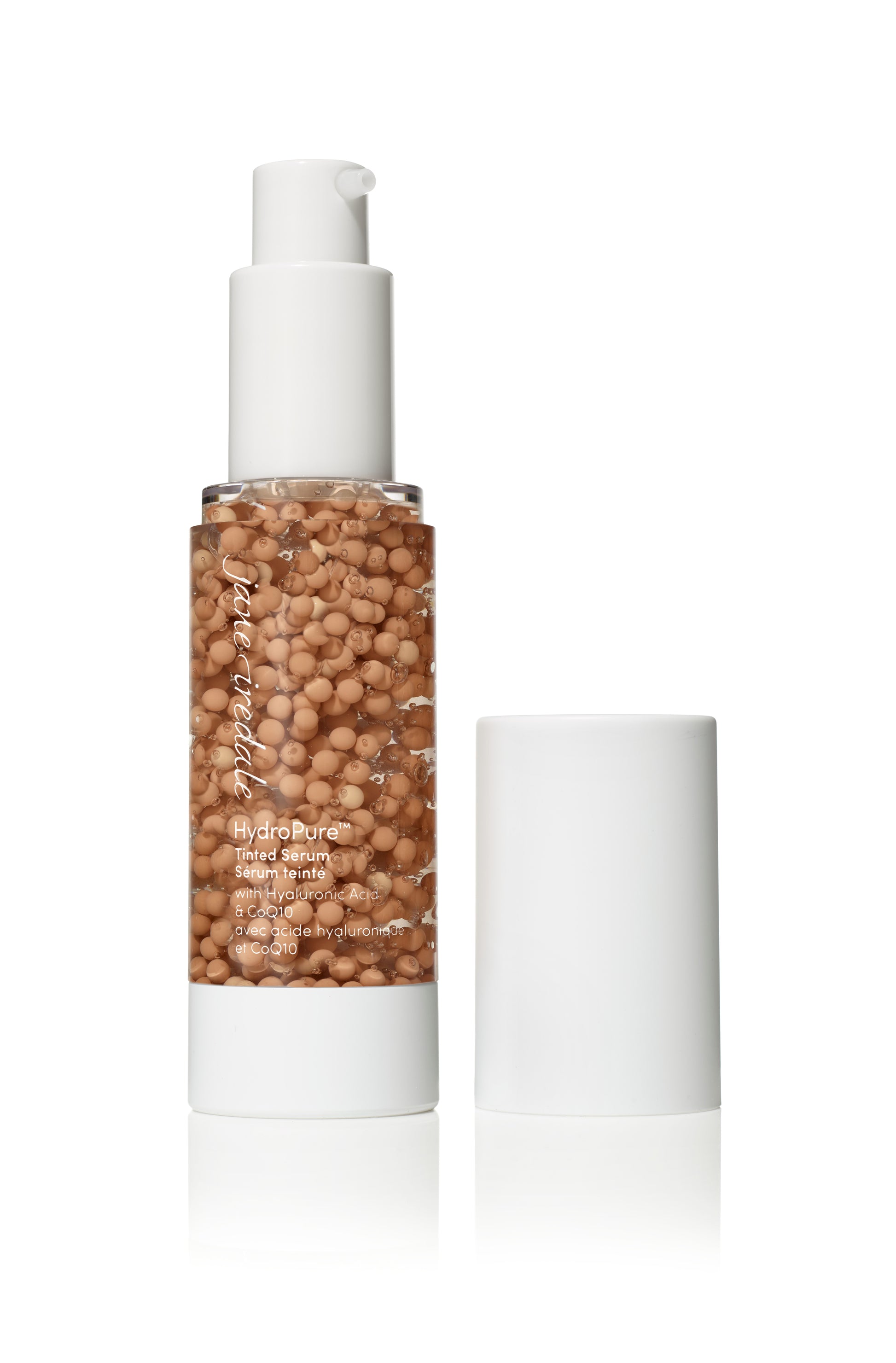 Jane Iredale HydroPure™ Tinted Serum in a clear pump bottle featuring beige pigment spheres, offering light coverage and hydration with Hyaluronic Acid and CoQ10.