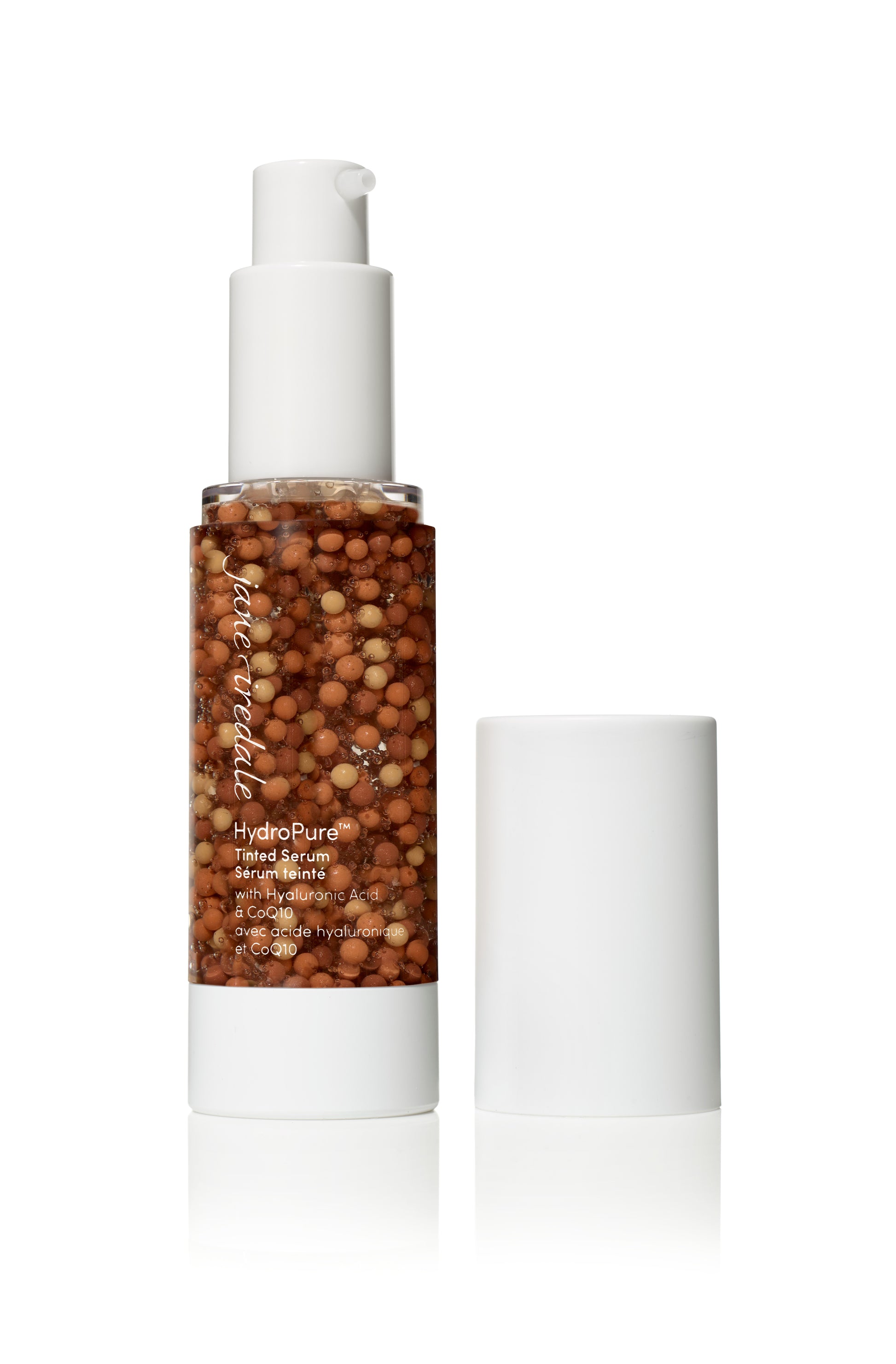 HydroPure™ Tinted Serum bottle with visible tan and cream micro-beads, offering light coverage and hydration with Hyaluronic Acid and CoQ10 for a radiant complexion.