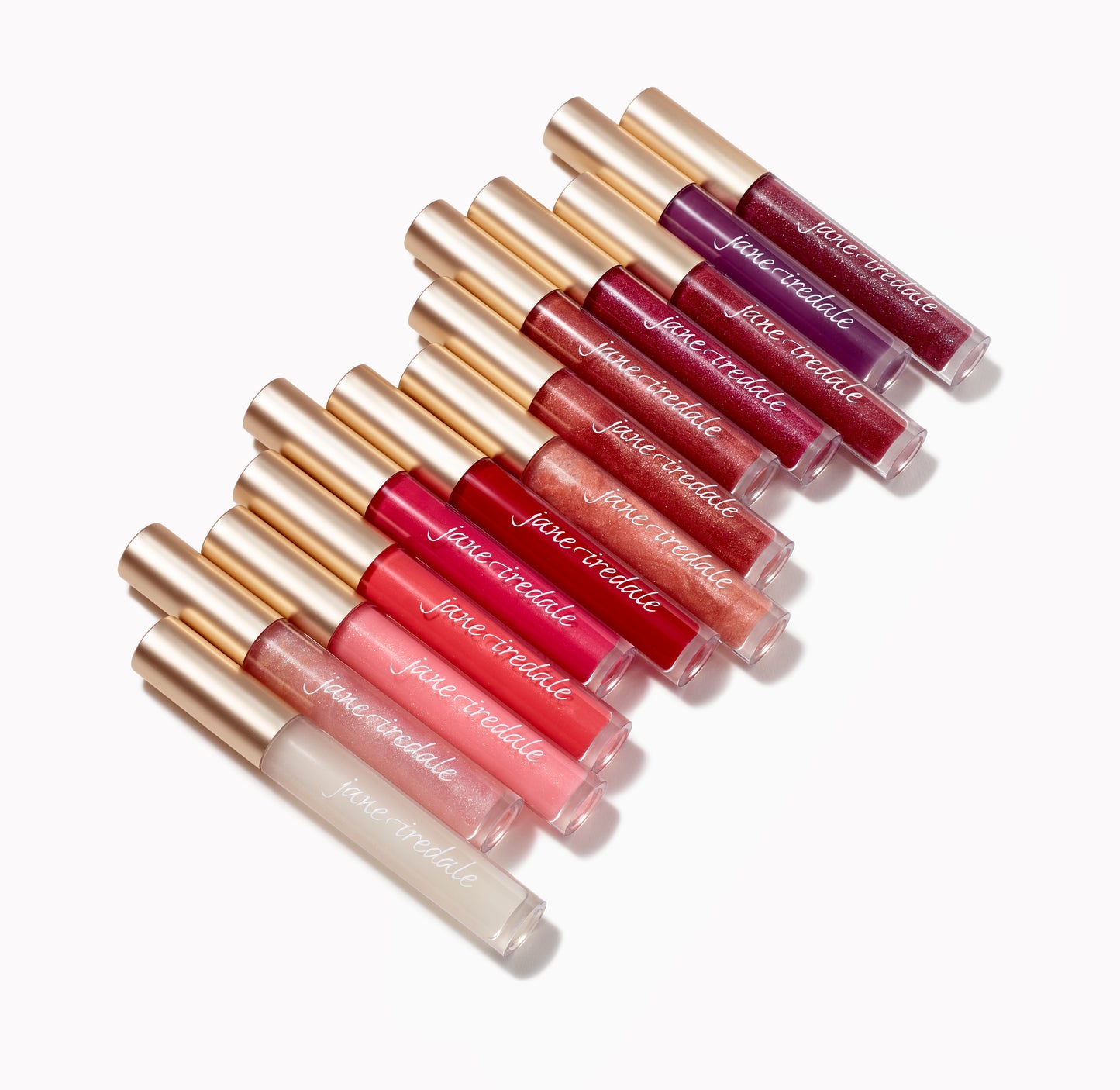 HydroPure™ Hyaluronic Acid Lip Gloss tubes arrayed diagonally, showcasing shades from clear to deep tones, featuring gold caps and nourishing, plumping formula.