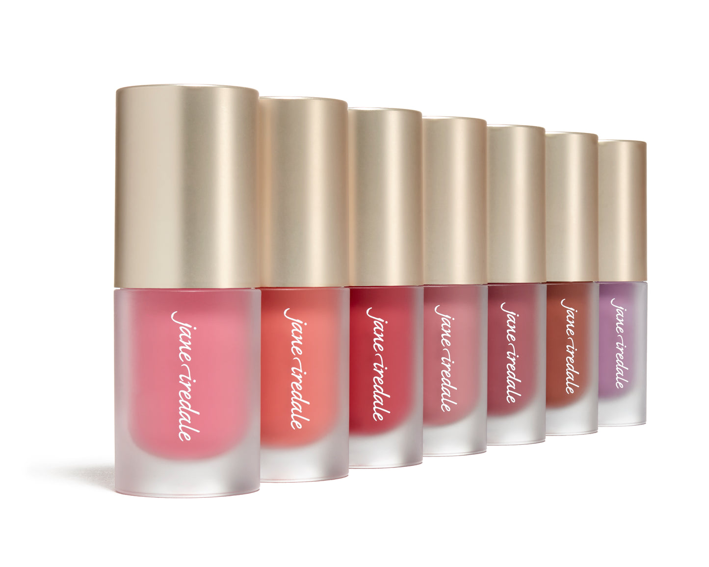 ColorLuxe Liquid Blush tubes with gold caps, showcasing seven shades for a natural flush. Features buildable, long-lasting formula that blends seamlessly for glowing skin.