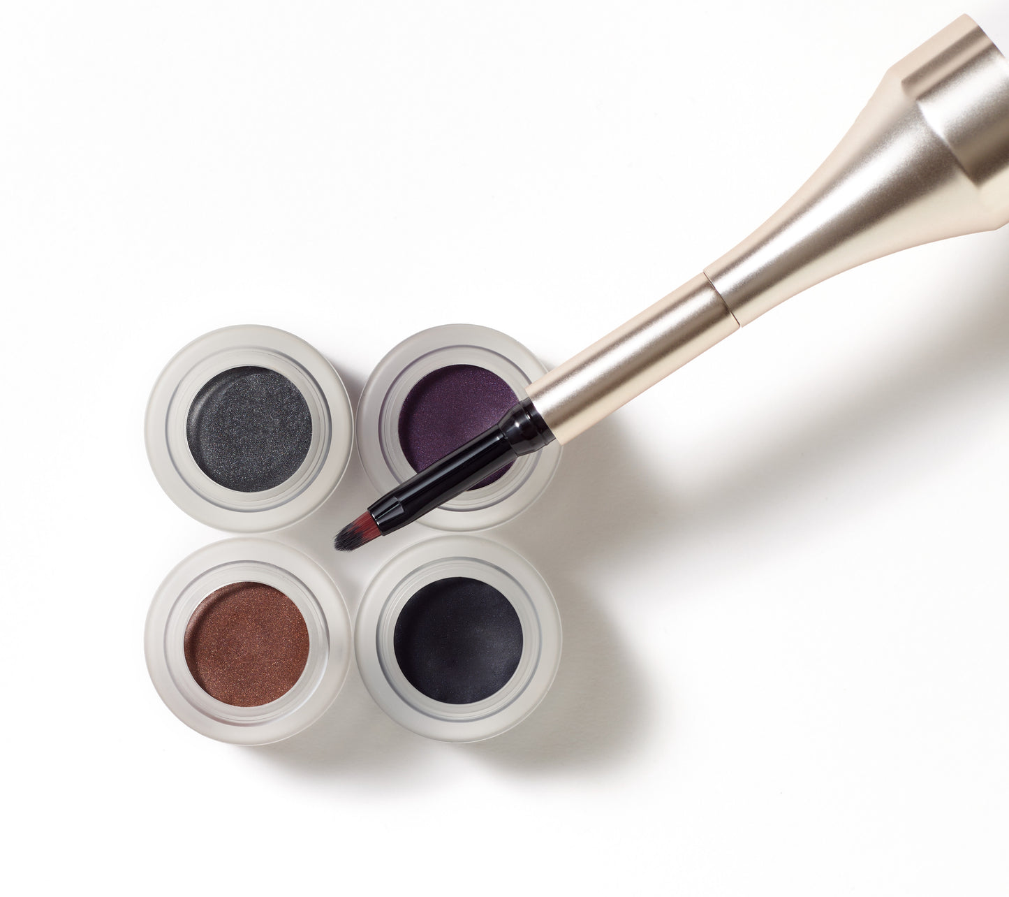 Mystikol® Powdered Eyeliner in four jewel-inspired shades with a dual-ended brush for versatile wet or dry application, ideal for sensitive eyes.