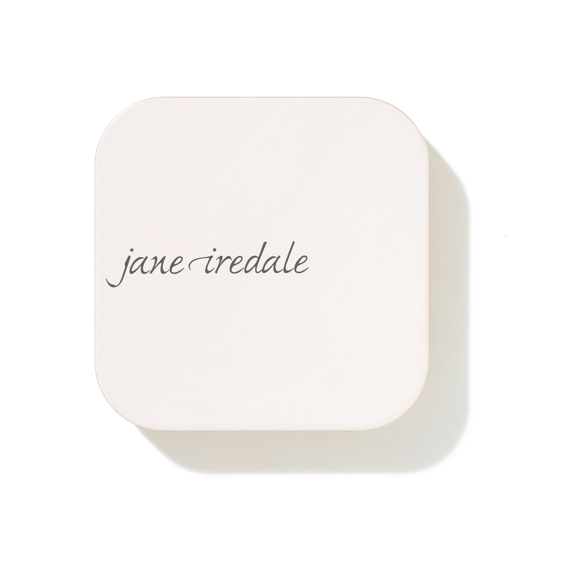 Jane Iredale's PurePressed® Blush compact, a sleek white case, offers a silky, buildable mineral formula with antioxidant protection for a natural, long-lasting flush.