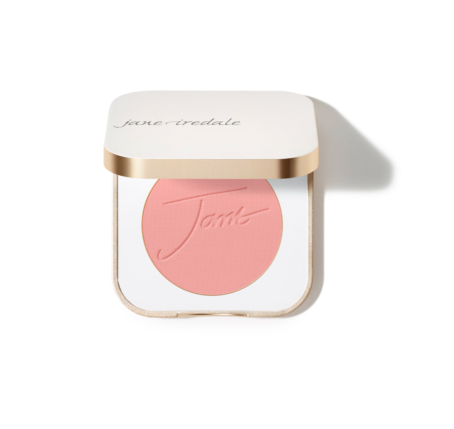 Jane Iredale PurePressed® Blush in a white compact with gold trim, featuring embossed Jane on pink pressed powder. Silky, buildable mineral formula for a natural flush.