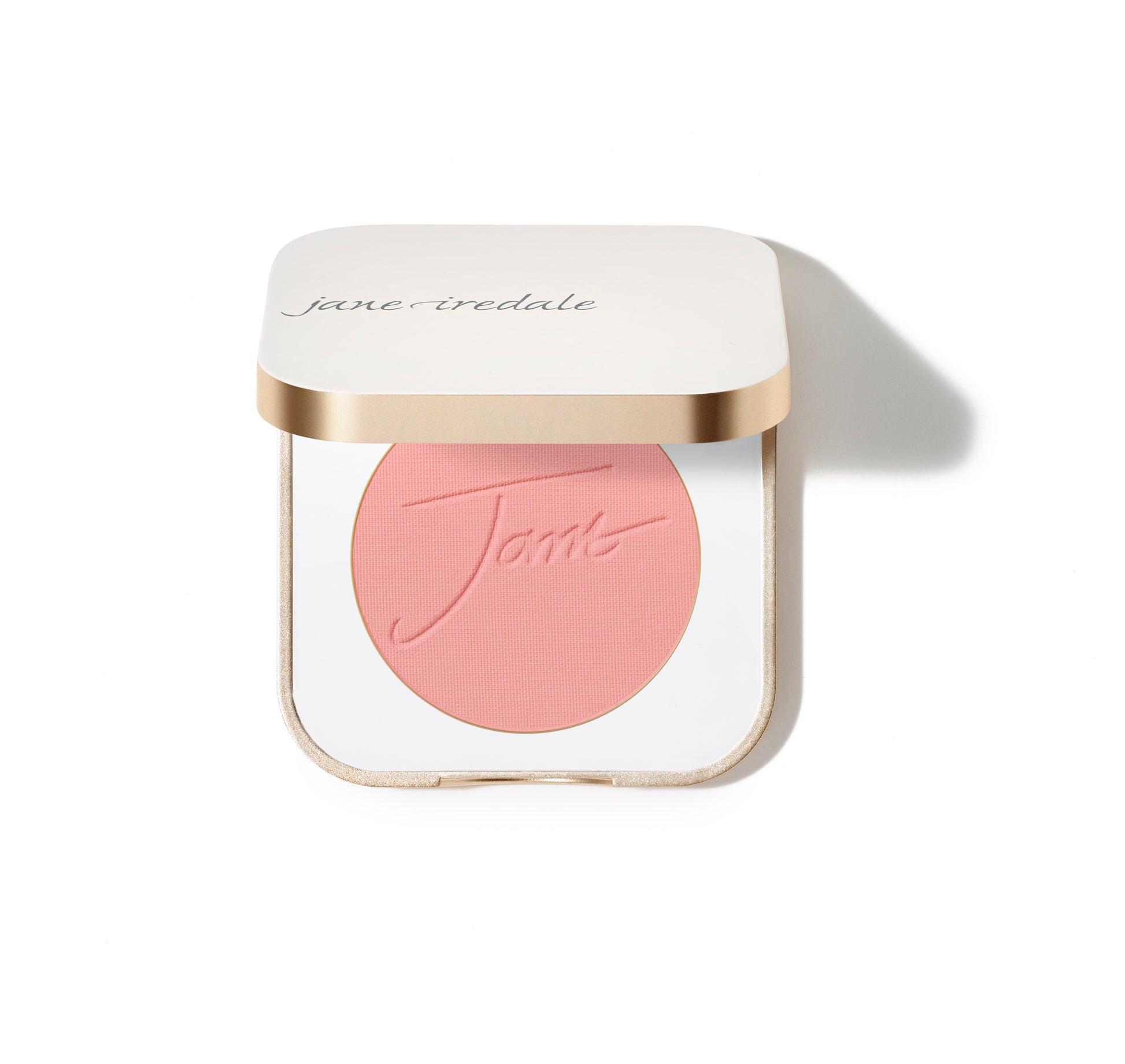 Jane Iredale PurePressed® Blush in a white compact with gold trim, featuring embossed Jane on pink pressed powder. Silky, buildable mineral formula for a natural flush.