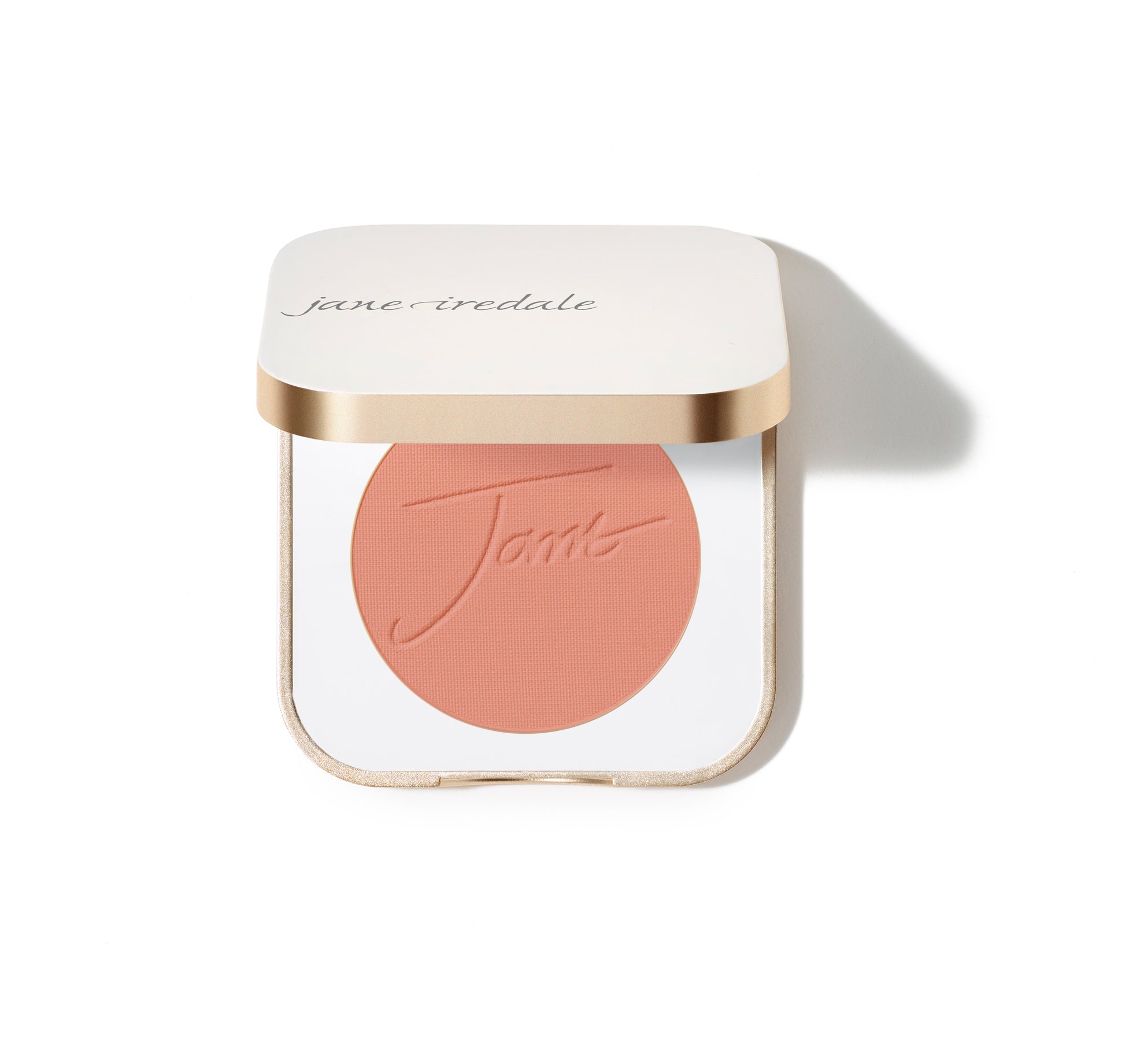 Jane Iredale PurePressed® Blush in a white-and-gold compact, featuring a peach pressed powder embossed with Jane, offering a natural, long-lasting flush.
