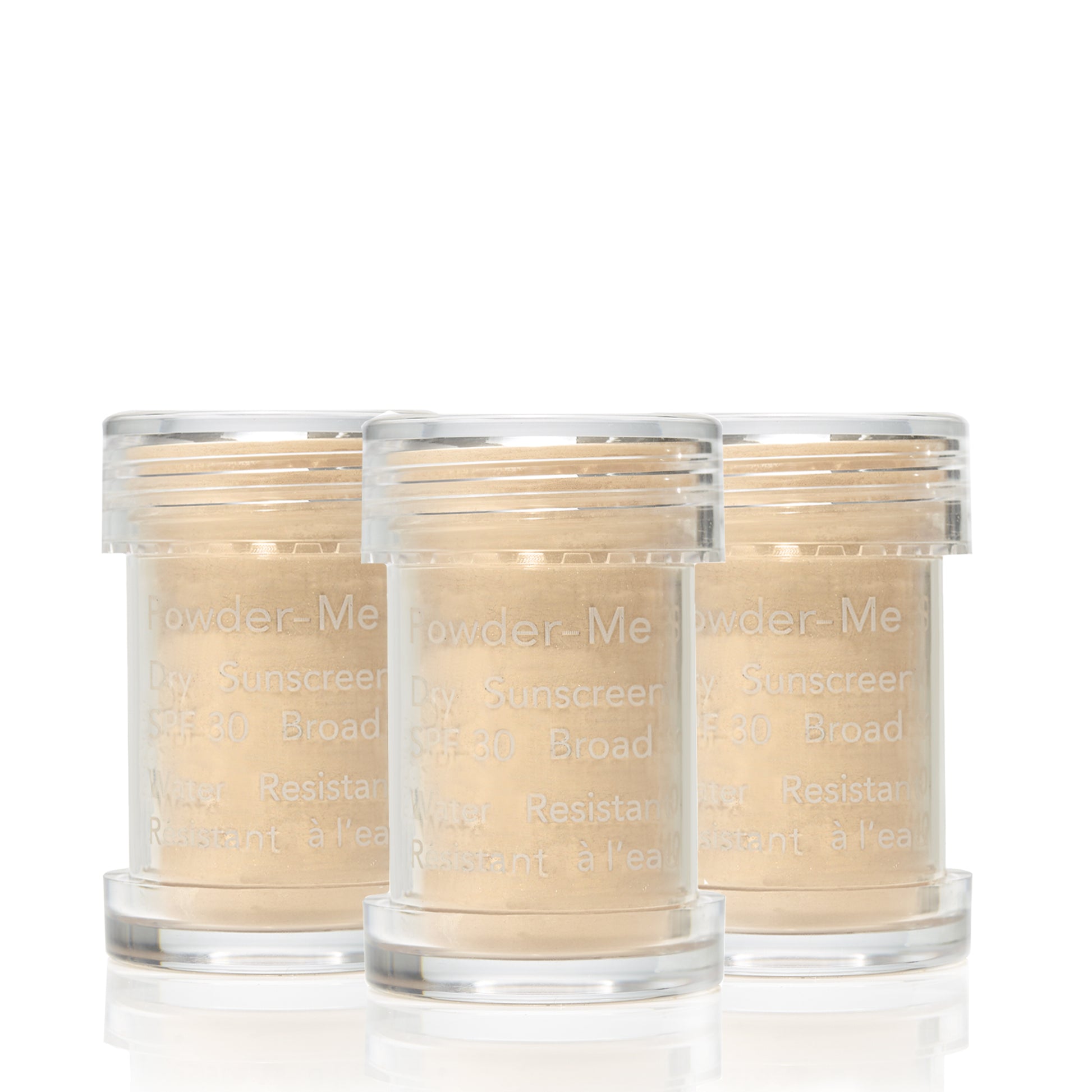Powder-Me SPF 30 Dry Sunscreen: Three clear canisters of broad-spectrum, water-resistant dry sunscreen powder, ideal for beauty enthusiasts seeking clean, sustainable skincare solutions.