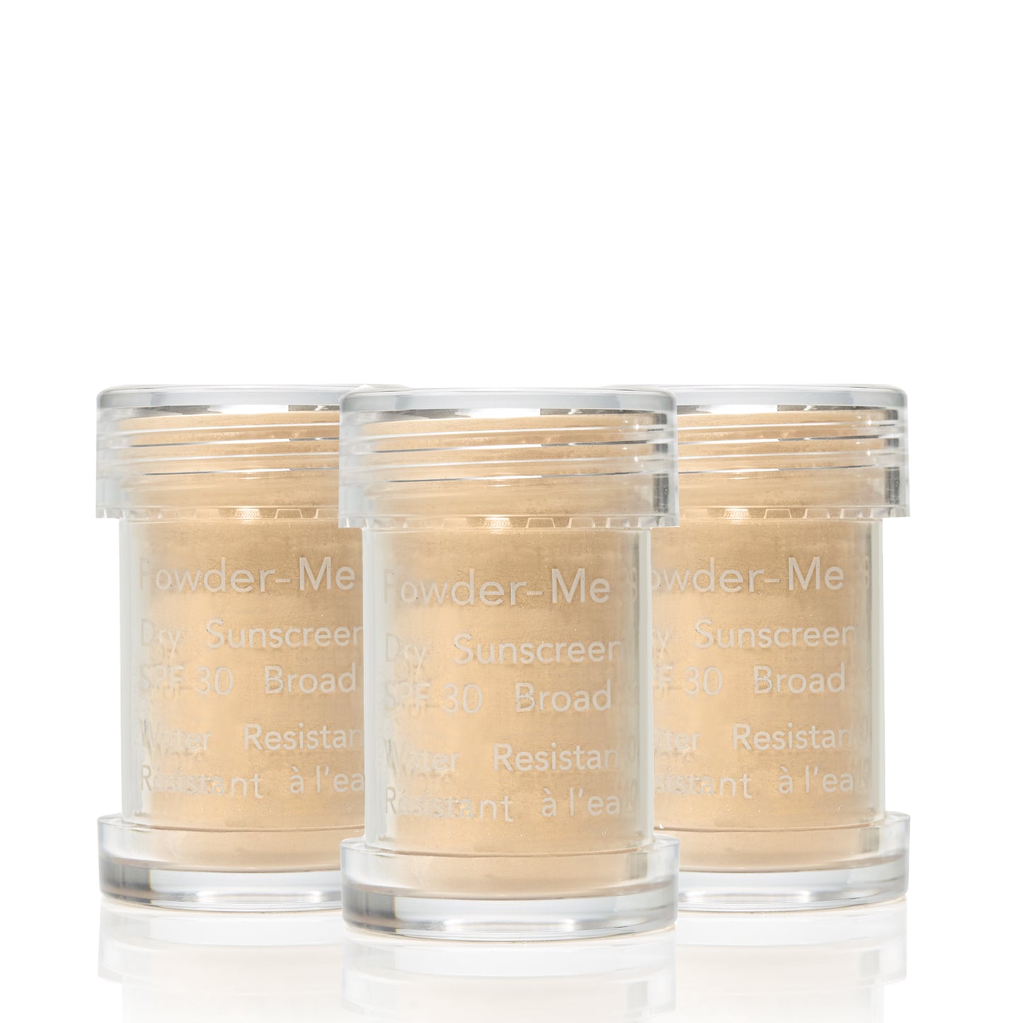 Three jars of Powder-Me SPF 30 Dry Sunscreen, showcasing beige loose powder, labeled for broad spectrum, water-resistant protection.