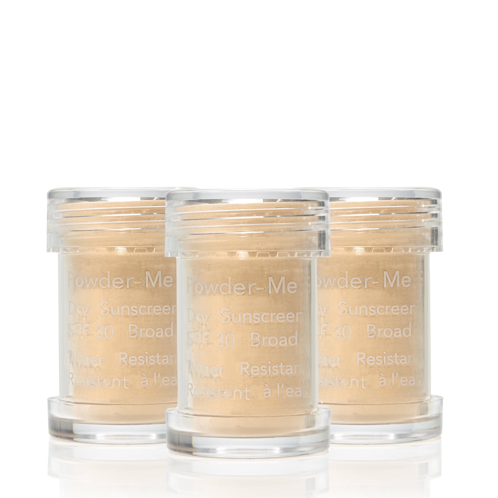 Three jars of Powder-Me SPF 30 Dry Sunscreen, showcasing beige loose powder, labeled for broad spectrum, water-resistant protection.